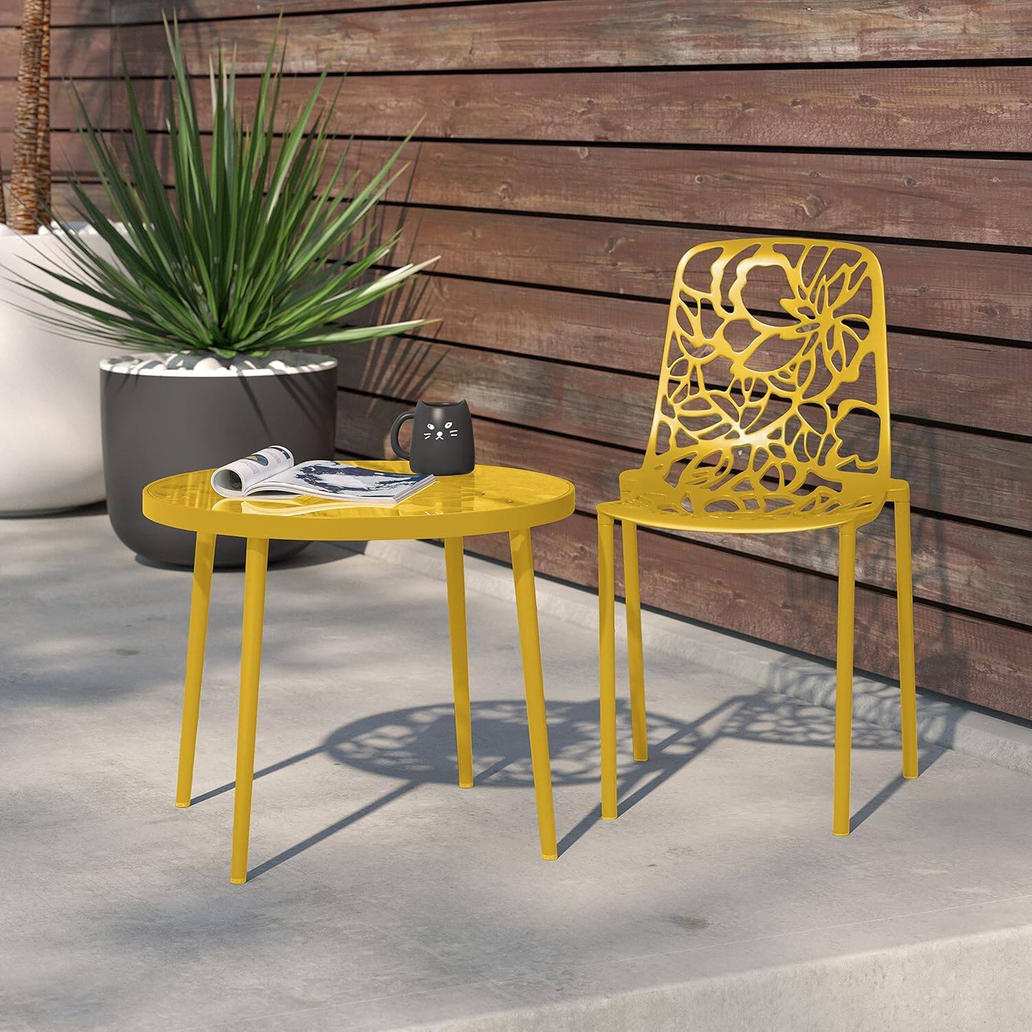 Angle. LeisureMod - Devon Stackable Aluminum Dining Chair, Modern Floral Cutout Indoor/Outdoor Patio Chair - Fully Assembled - Yellow.