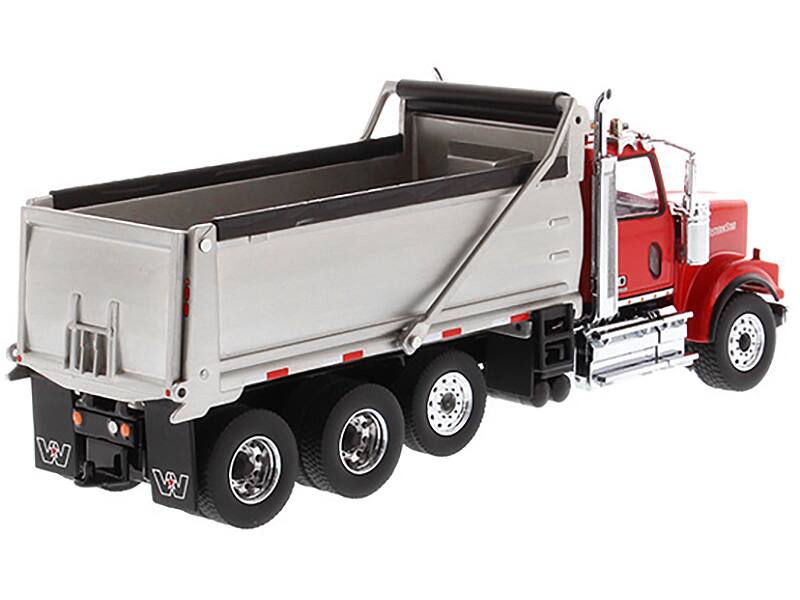 Left. Diecast Masters - Western Star 4900 SF Dump Truck Red and Silver 1/50 Diecast Model by Diecast Masters - Red and Silver.