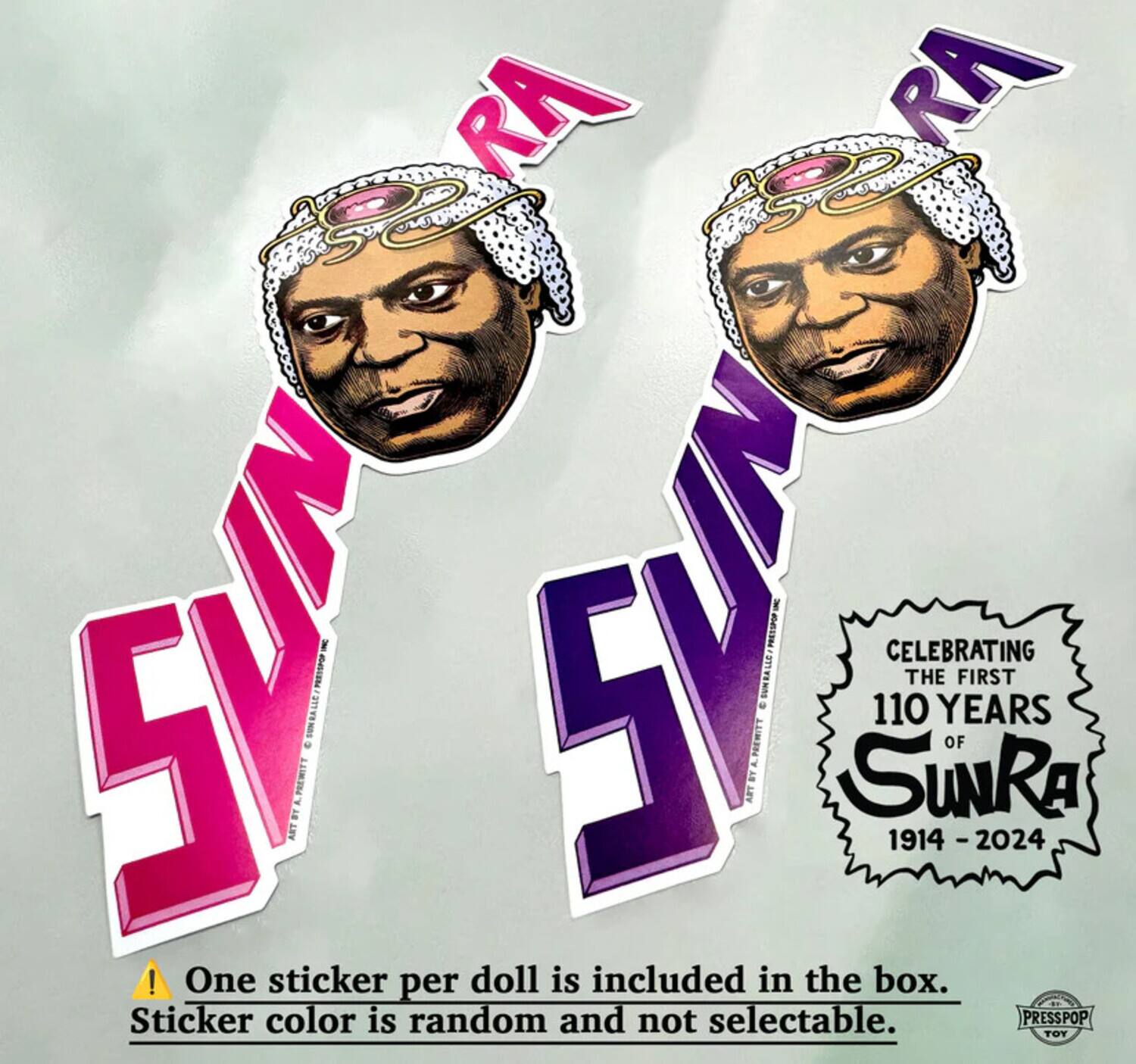 Sure, here is the corrected and grouped text:

---

**Sun Ra**

**CELEBRATING THE FIRST 110 YEARS OF Sun Ra 1914 - 2024**

One sticker per doll is included in the box.  
Sticker color is random and not selectable.

PRESSPOP TOY

---