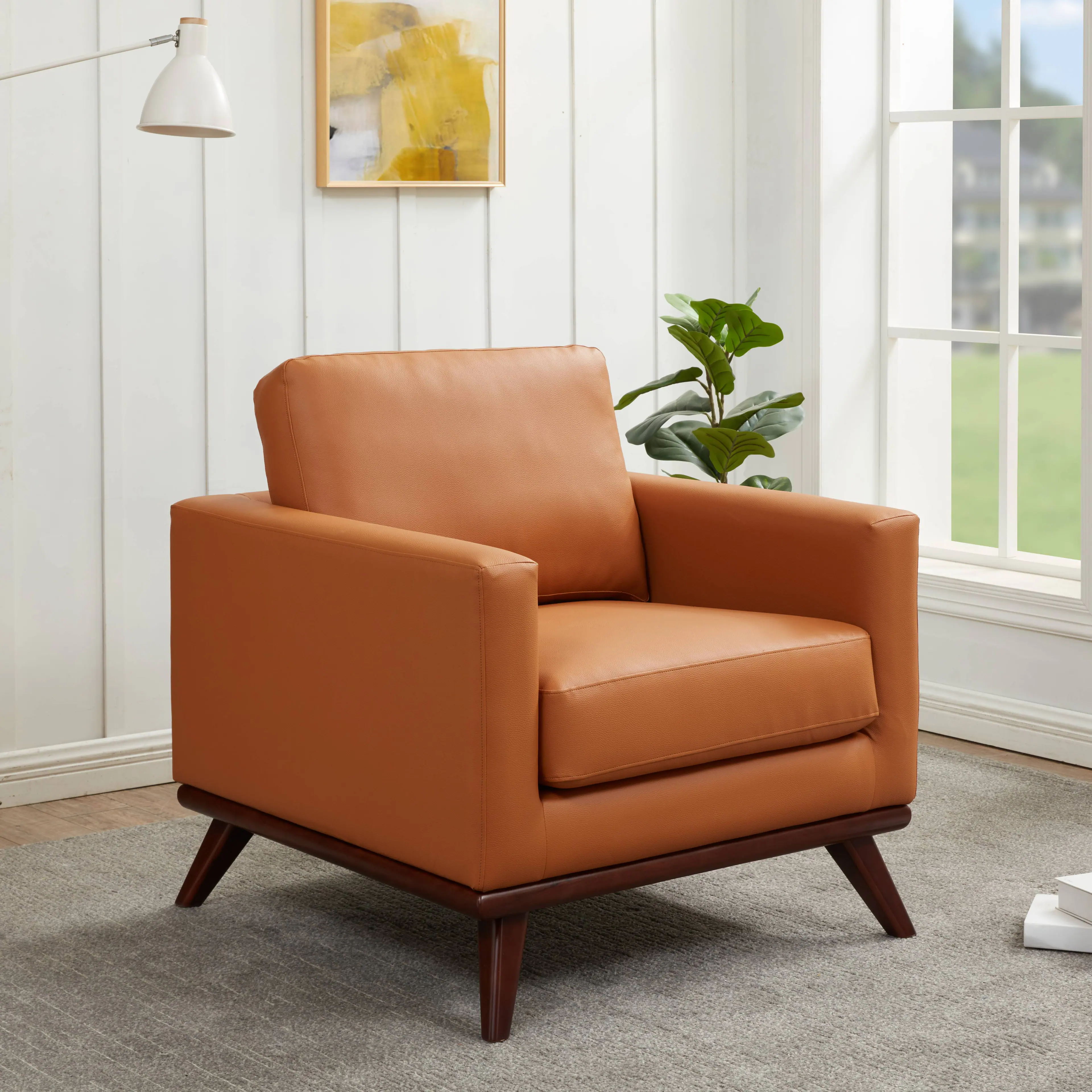 Angle. LeisureMod - Chester Mid-Century Modern Leather Accent Chair, Birch Wood Frame Armchair - Easy Assembly - Cognac Tan.