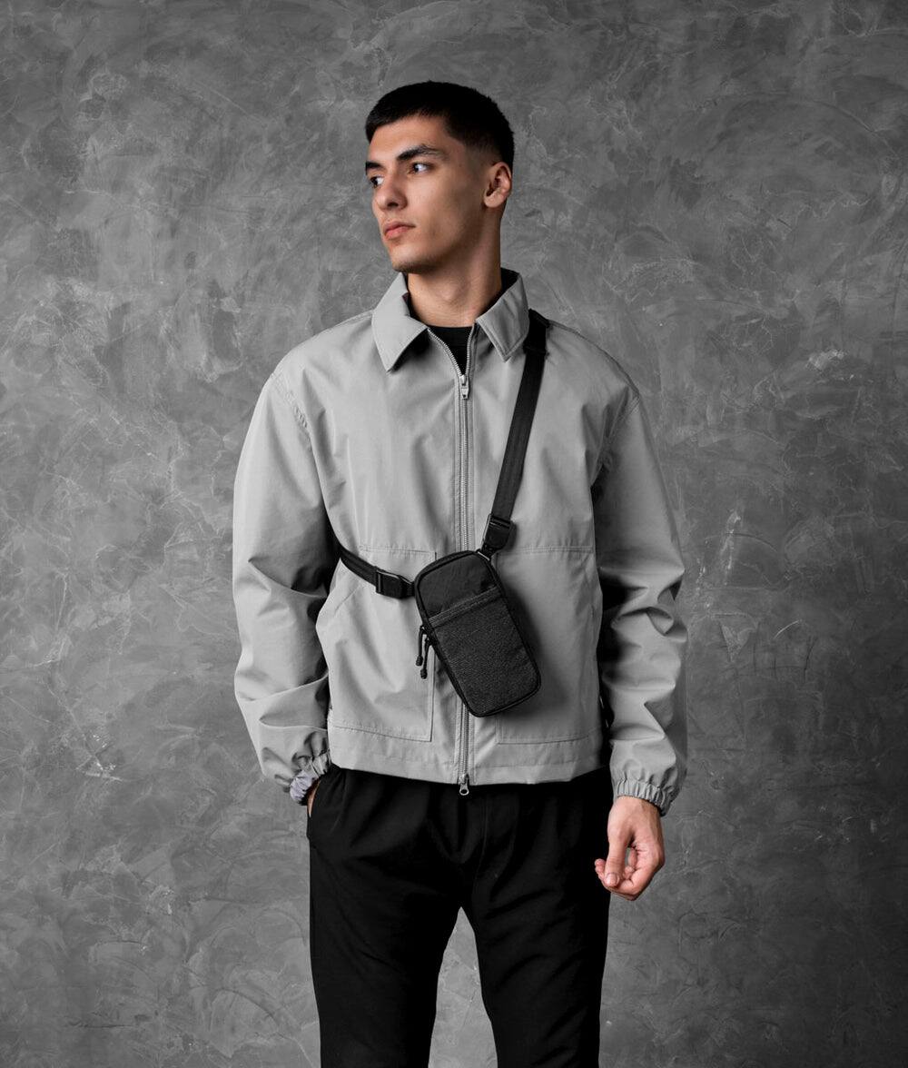 Angle. ALPAKA - Crossbody Phone Bag & EDC Organizer - Modular Shoulder Pocket Max for Travel, Weather-Resistant - Black Ultradyne 100D.