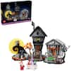 The image features a Halloween-themed LEGO set, which includes a haunted house, a graveyard, and a clock tower. The set also features a Santa Claus figure, indicating a mix of Halloween and Christmas elements. The LEGO set is designed for children and is part of the Disney LEGO Ideas series.
