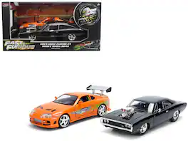 Dom's 1970 Dodge Charger R/T Black and Brian's Toyota Supra Orange with Graphics Set 1/24 Diecast Model Cars by Jada