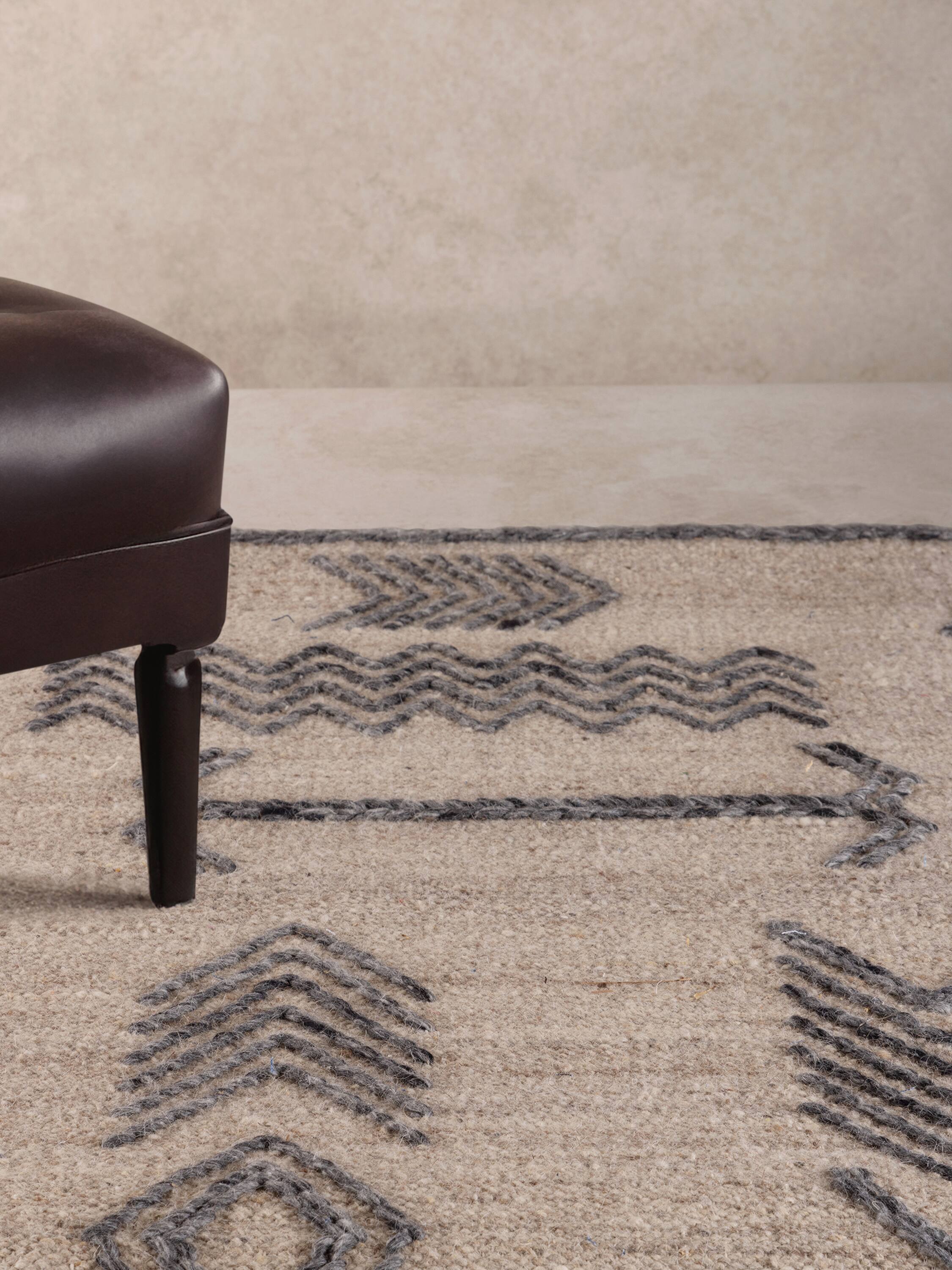 Angle. GAURI KOHLI - Lunar Rug - Shades of beige, brown and gray.