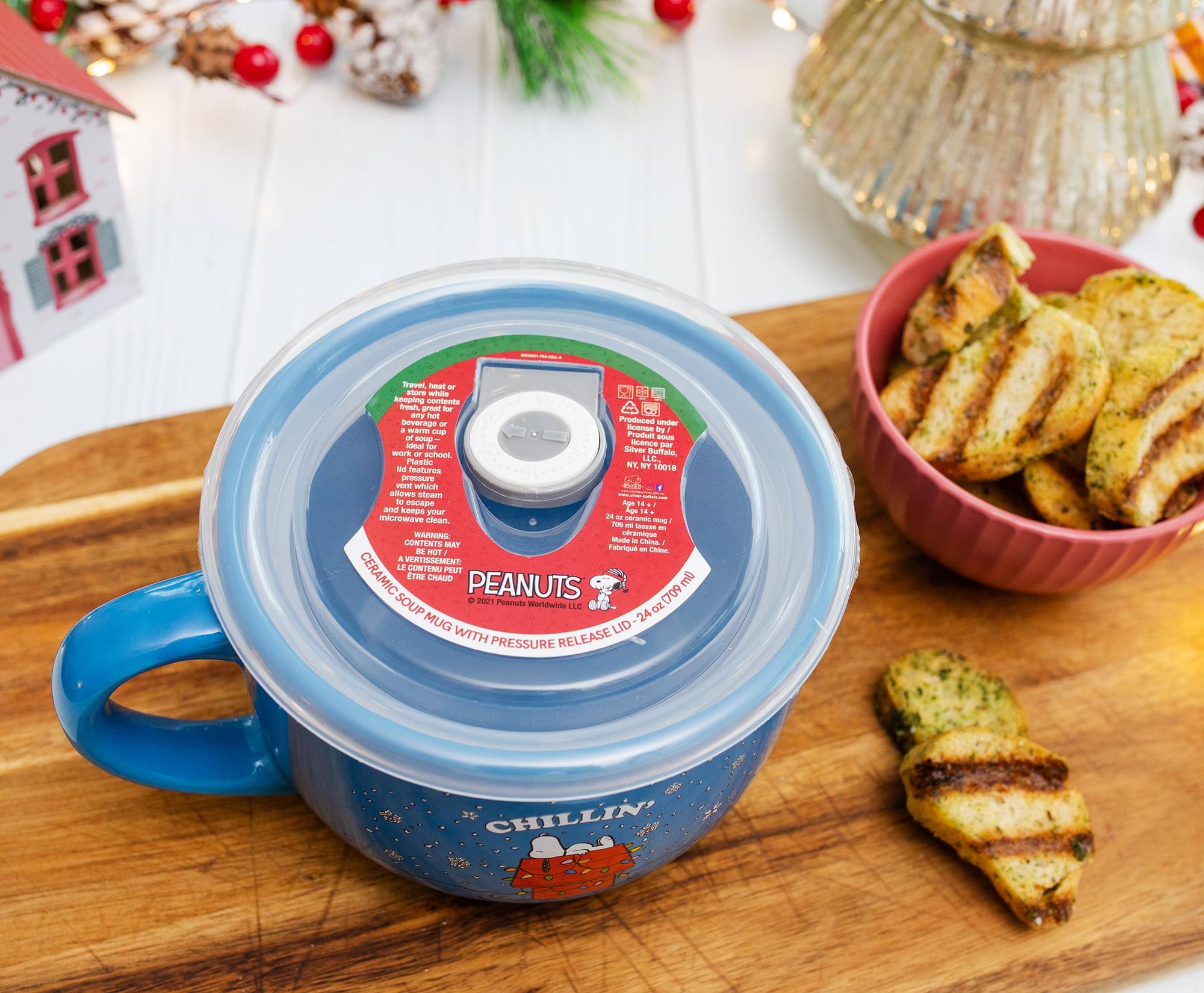 Sure, here is the corrected and grouped text from the image:

---

**PEANUTS**

**CHILLIN'**

**ORGANIC SOUP MUG WITH PRESSURE RELEASE LID**

**24 oz (709 mL)**

**MADE IN CHINA**

**WARNING:**

**CONTENTS MAY BE HOT.**

**NE PAS ÉTIRER LE CONTENU.**

**Features:**

- Travel, heat or store a keeping compartment for great - amy Fant beverage - Produced uoin + mames - Scenne hy of - Produit - Ioul -r ncence par MOrk Stfeer Burtate. - achoot LLC Plastic WY, NY ad Features 1001 prossure - which BLIS 1 allows Iledmm to escape age and konps your Aae microwave in - clean - im - SNAN - MARNING ceramique CONTENTE Mud - Chia MAP Fabriout R HOT - Loa a VERTISSEMENT LE CONTENU PEUT CERAMIC ETRE CHALO PEANUTS ml SOUP e 2029 Auts Worldwide LLE 24 oz(709 oz MUG LID WITH