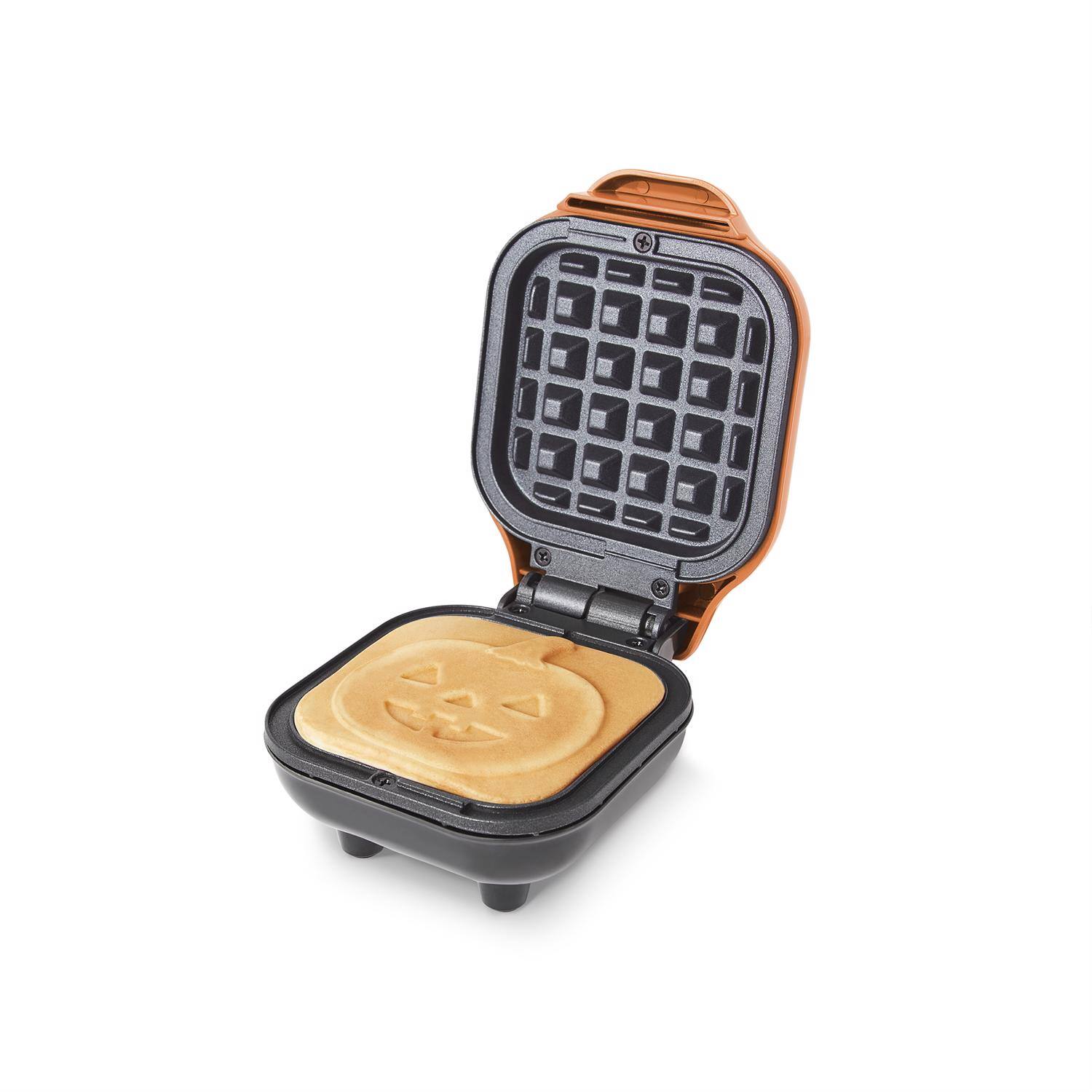 Angle. DASH - Rise by Dash Jack-O-Lantern 1 waffle Orange Plastic Waffle Maker - Orange.