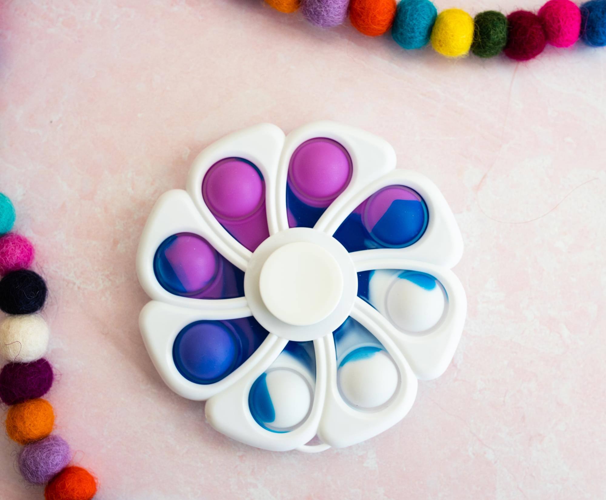 Alt View 1. Toynk - Pop Fidget Toy Spinner White Flower 8-Button Bubble Popping Game - Blue.
