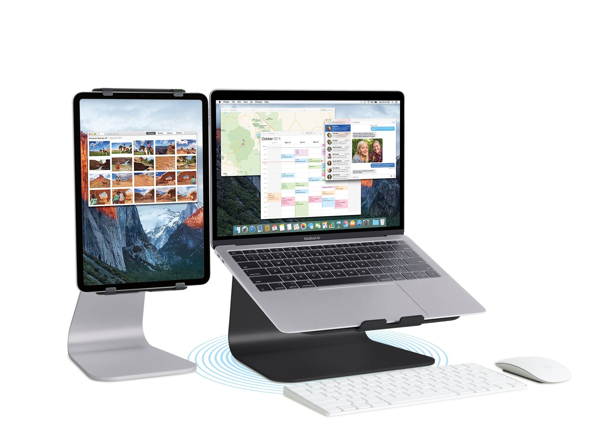 The image shows a laptop and a tablet computer sitting on a desk. The laptop is positioned on the left side of the desk, while the tablet is on the right side. The tablet is connected to the laptop, and the laptop is connected to a keyboard and a mouse. The tablet and laptop are both displaying a calendar, indicating that they are being used for productivity and organization purposes.