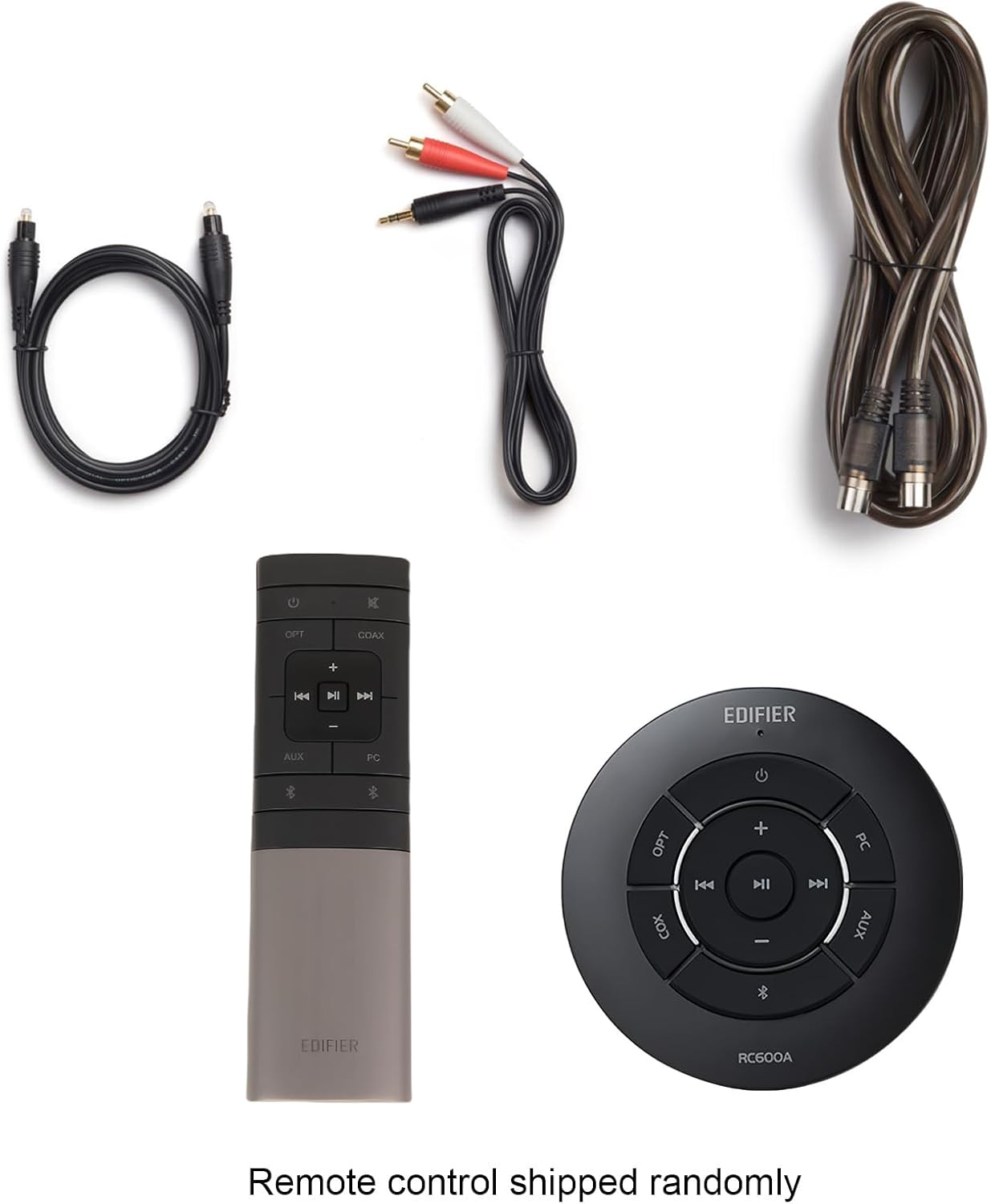 The image features a collection of electronic devices, including a remote control, a speaker, and a cable. The remote control is shipped randomly, which means it may not be the same as the one in the image. The speaker and cable are also part of the collection, and they are placed next to the remote control.