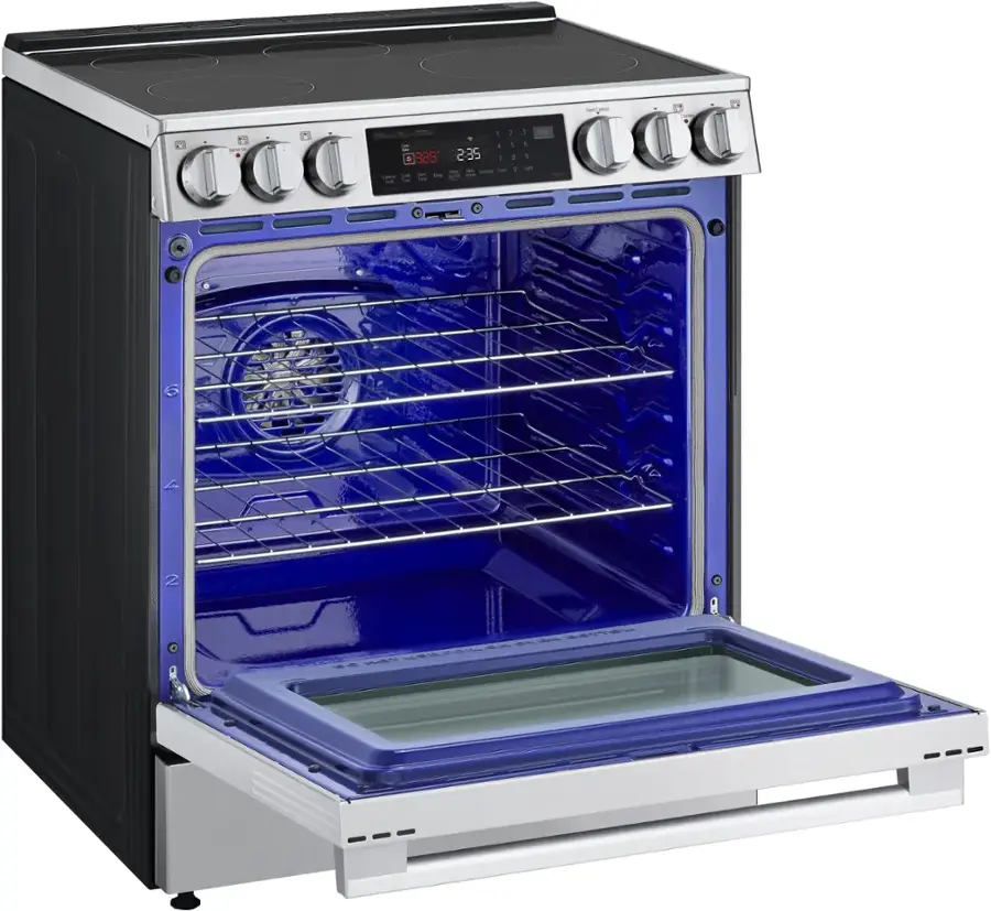 The oven is blue and silver in color. The oven is open, and it has a digital clock on the front. The clock displays the time as 2:35.
