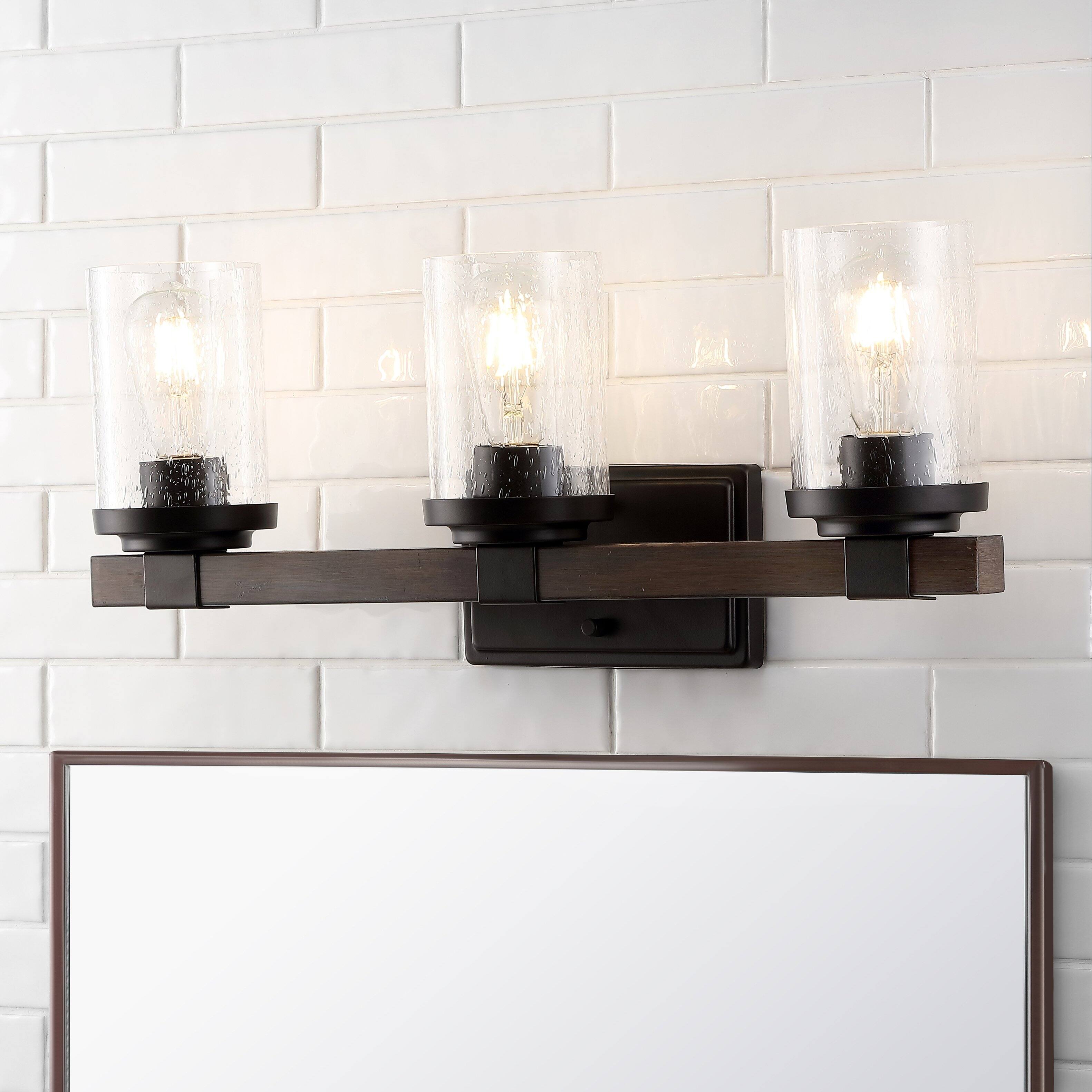 Alt View 1. Jonathan Y - Bungalow 22.75" 3-Light Iron/Seeded Glass Rustic Farmhouse LED Vanity Light, Oil Rubbed Bronze - Oil Rubbed Bronze.