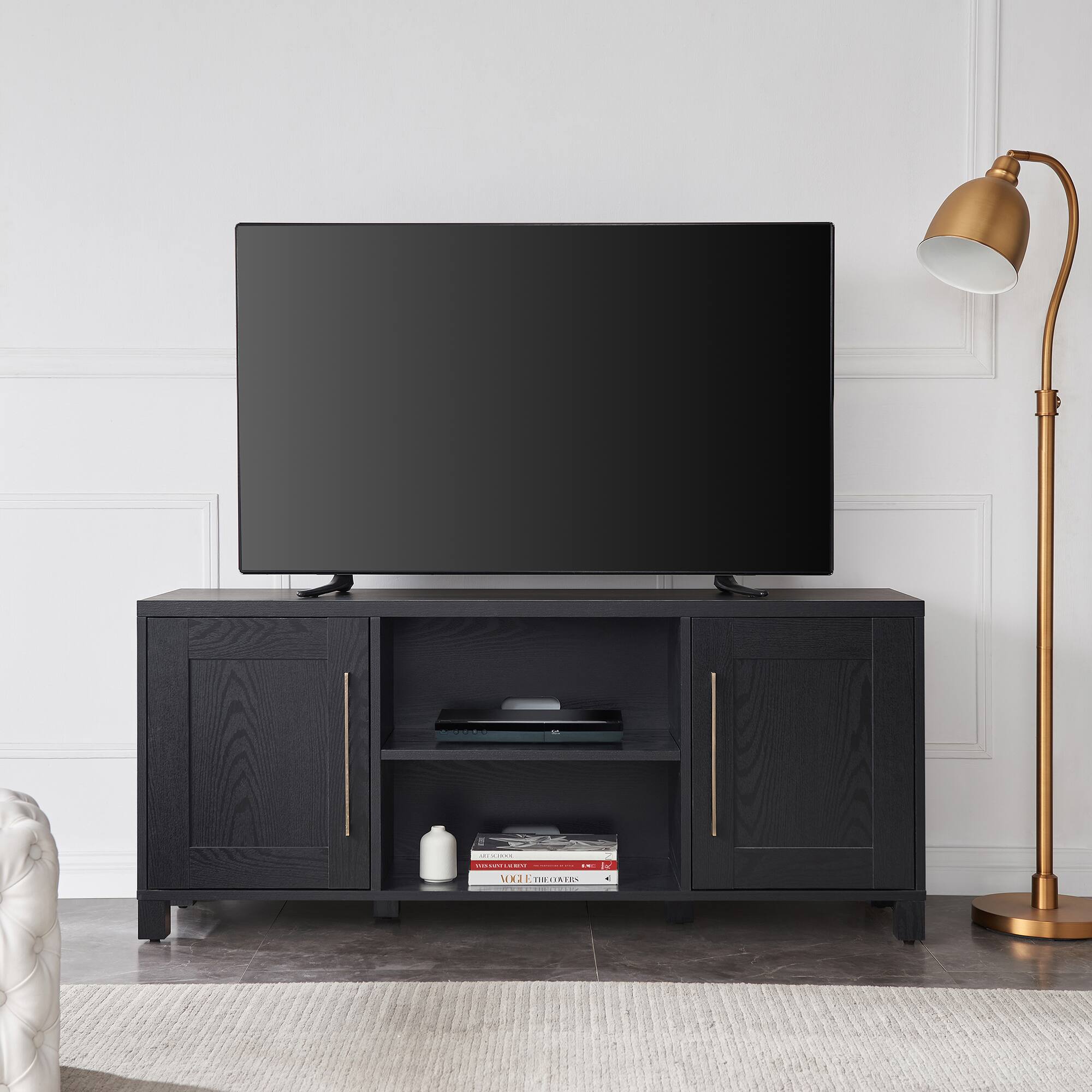 The text on the image reads "N N | - E VHJ ETHEGIATRS W". However, it is not clear what this text represents or its relevance to the image. The image features a flat screen TV sitting on a wooden stand in a living room.