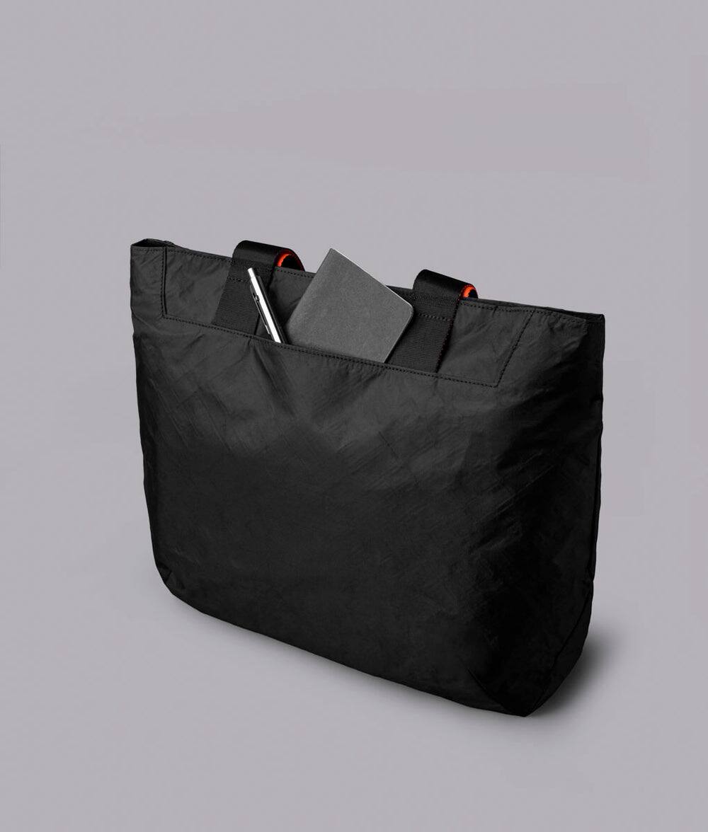 Alt View 2. ALPAKA - Elements Tote Bag 14.5L Weatherproof Foldable Travel Tote with Magnetic Closure - Black Axoflux 210D.