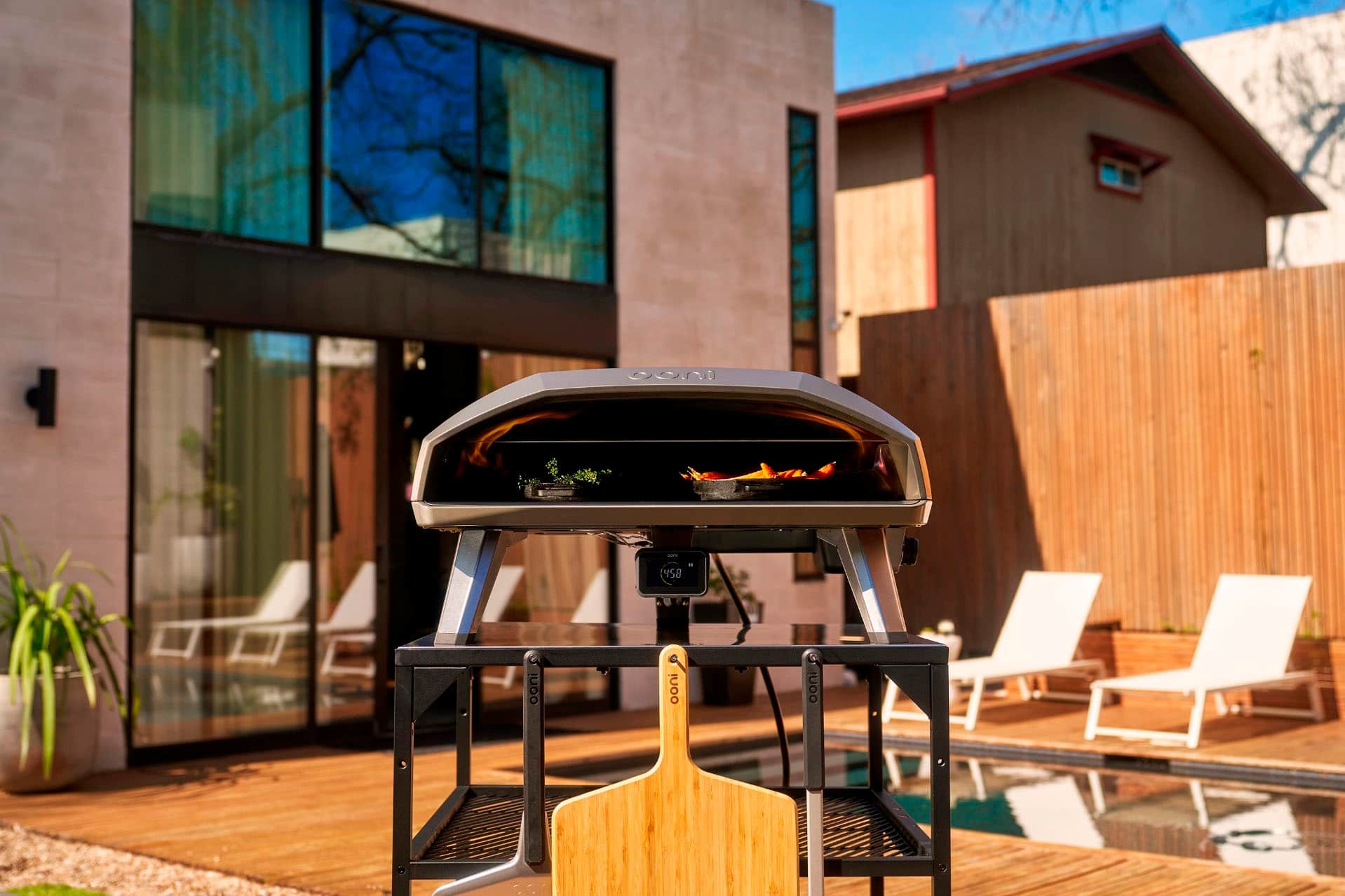 I cannot group or correct the text as it does not appear to be related to the image. The image shows a backyard with a grill, chairs, and a house. The text does not provide any context or information about the image.