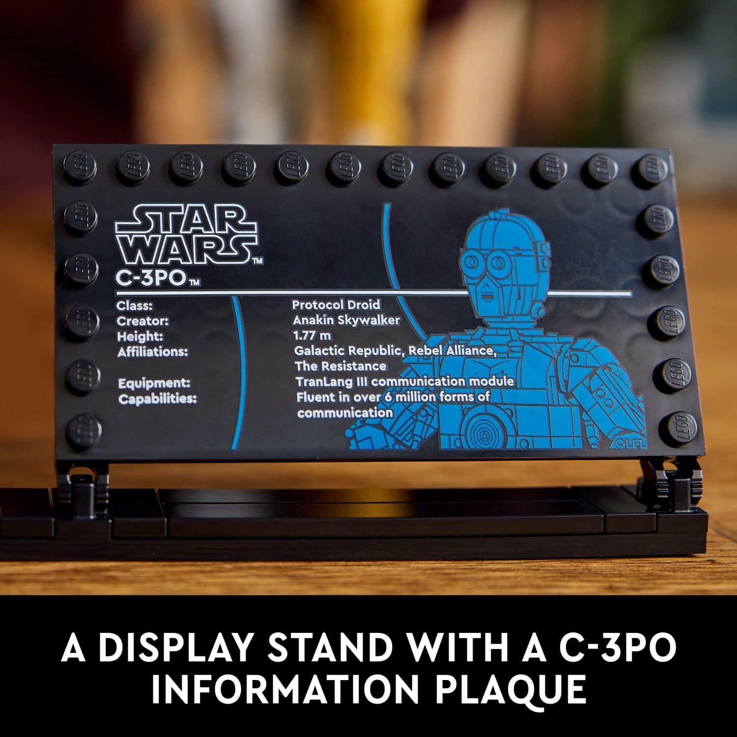 A display stand with a C-3PO information plaque.
