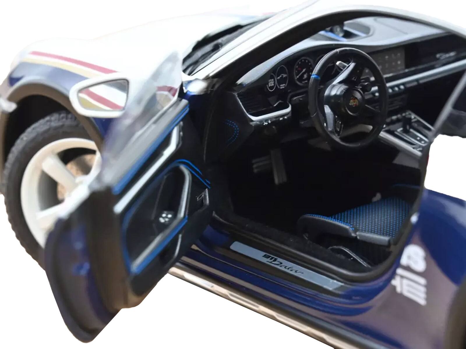 Back. Norev - 2023 Porsche 911 Dakar #953 "Roughroads Porsche" Blue and White with Stripes 1/18 Diecast Model Car by Norev - Blue and White.