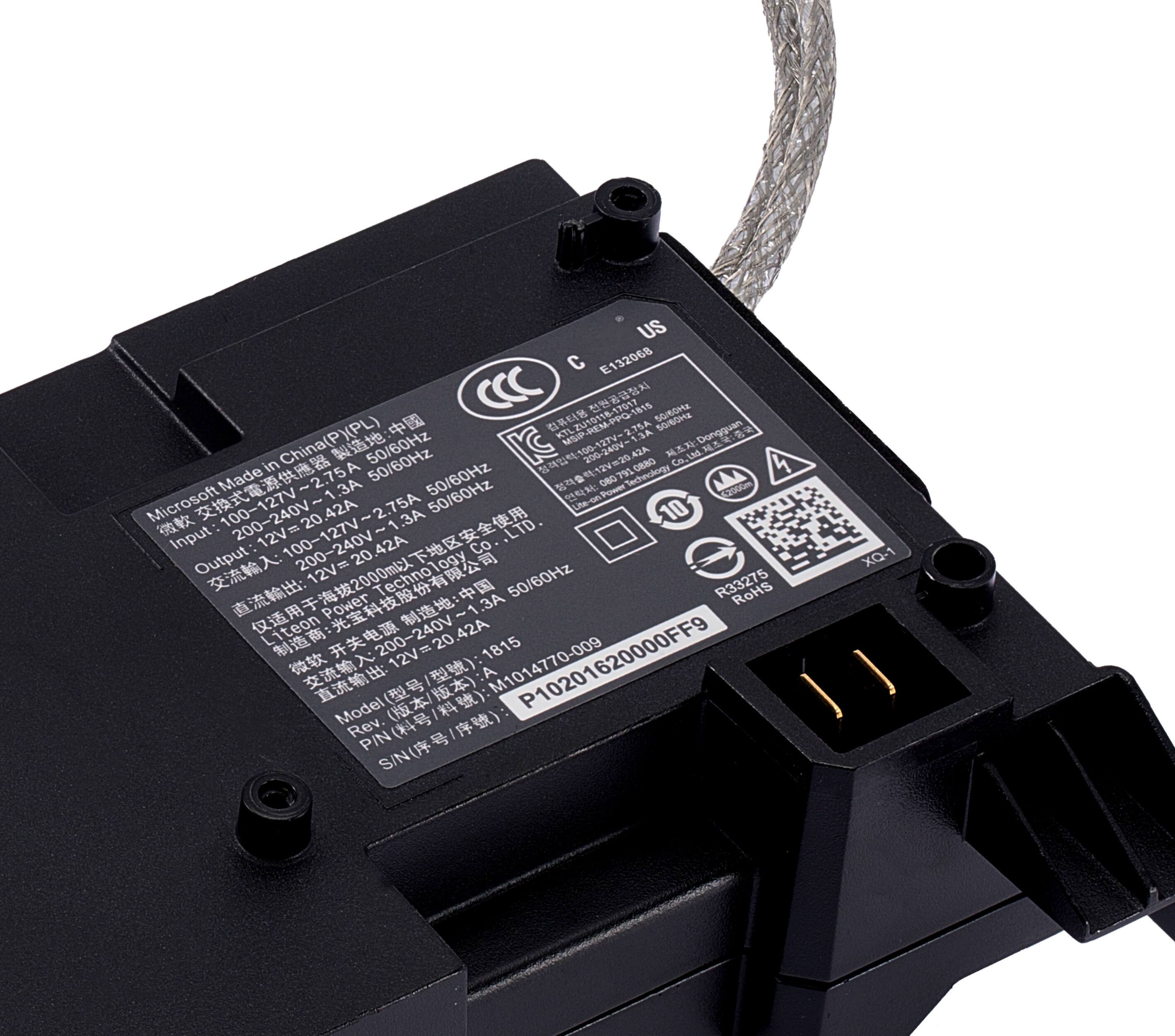 Sure, here is the corrected and grouped text from the image:

---

**US C E132068**

**Microsoft Made in China (P)(PL)**

**Input:** 100-240V~ 1.3A 50/60Hz

**Output:** 12V=20.42A

**Model:** P10201620000FF9

**Rev. P/N:** P10201620000FF9

**S/N:** 1620000FF9

**Made in China**

**50/60Hz**

**12V=20.42A**

**Liteon**

**RoHS**

**C**

**CE**

**FCC**

**CCC**

**XO-1**

**R34275 RONS**

**P/N:** M1014770-009

**S/N:** M1014770-009

**Input:** 100-240V~ 1.3A 50/60Hz

**Output:**