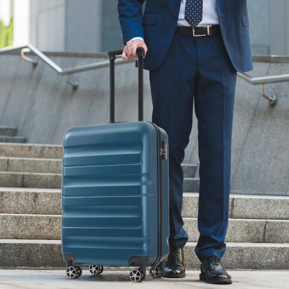 Angle. BreeBe - 20-Inch Hardshell ABS Carry-On Luggage with Spinner Wheels, Lightweight Travel Suitcase Set with Foldable Duffel Bag - Inky Blue.