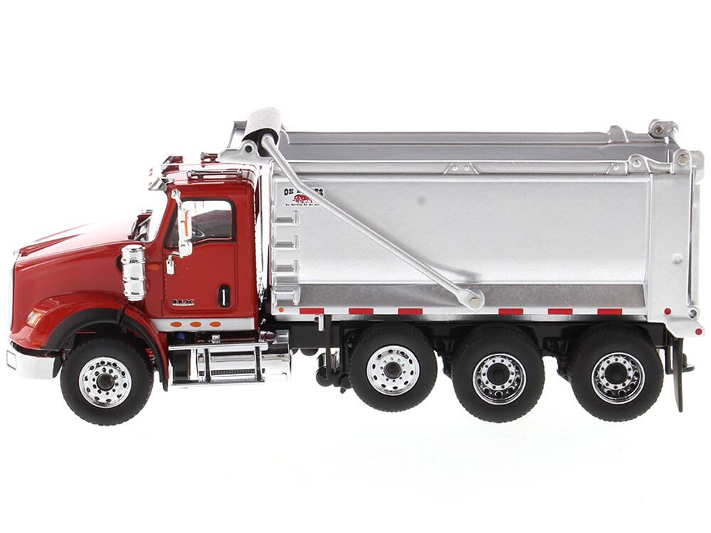 Angle. Diecast Masters - International HX620 Tandem Axle with Pusher Axle OX Stampede Dump Truck Red and Chrome "Transport Series" 1/50 Diecast - Red.