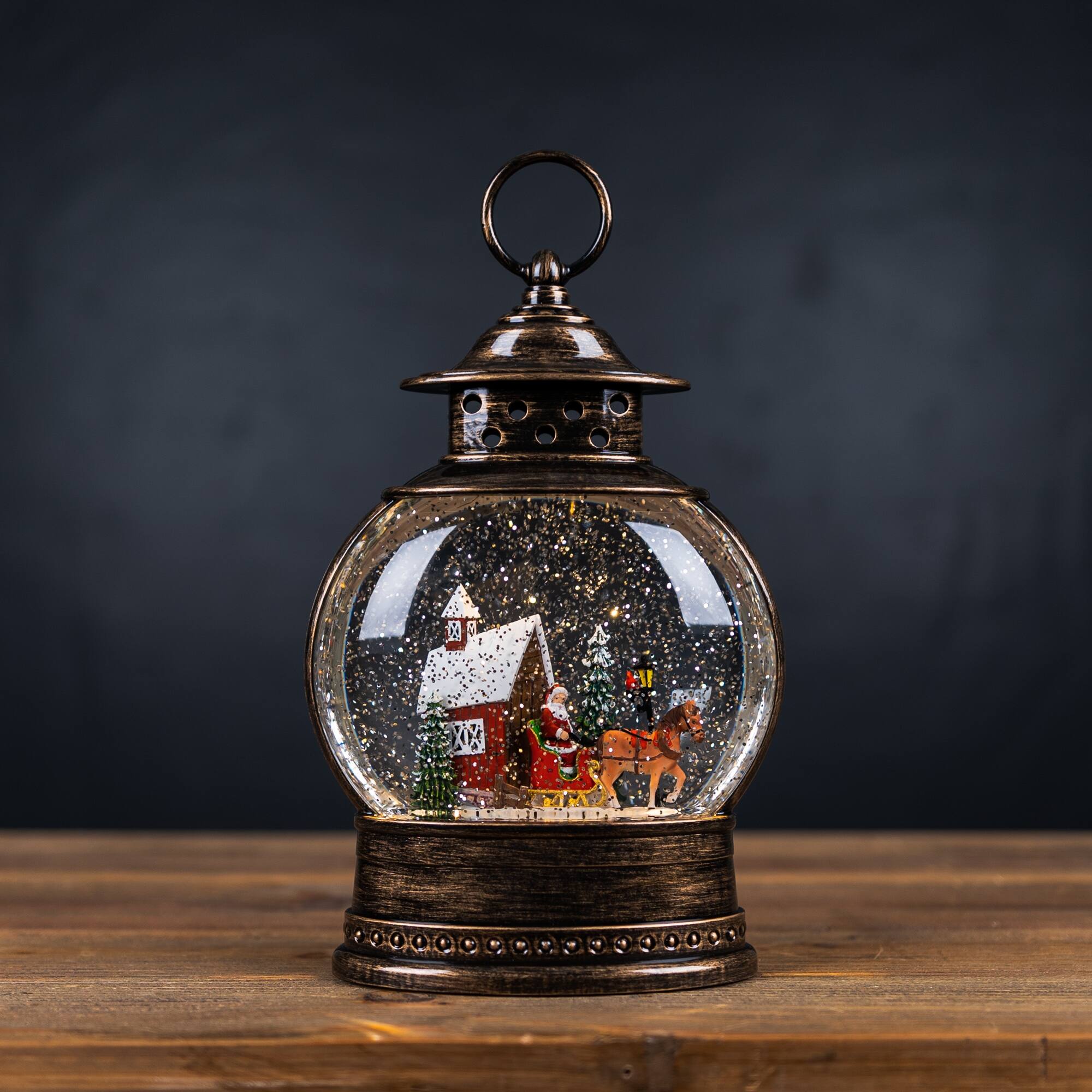 Angle. BreeBe - LED Snow Globe with Santa's Sleigh 11.5"H - Bronze, Red.
