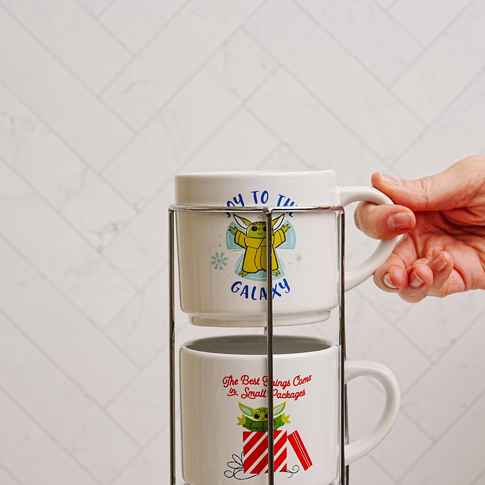 Sure, here is the corrected and grouped text from the image:

1. Top Mug:
   - "TO THE GALAXY"

2. Bottom Mug:
   - "The Best Gifts Come in Small Packages"