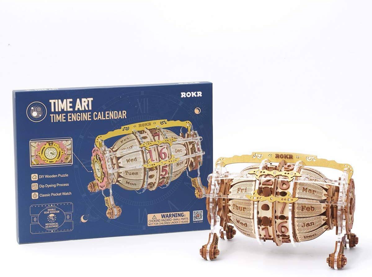 TIME ART XII TIME ENGINE CALENDAR  
ROKR  

DIY Wooden Puzzle  
Dip Dyeing Process  
Classic Pocket Watch  
DOUBLE GEAR NOTATION  
MECHANICAL ADJUSTMENT  

WARNING:  
CHOKING HAZARD - SMALL PARTS  
NOT FOR CHILDREN UNDER 3 YEARS  

6 Dec - Wed  
5 Nov - Tues  
16 Jan - Fri  
16 Feb - Wed