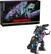 The image features a robot toy, likely a Transformer, standing next to a box that says "Transformers: Age of Extinction Trypticon." The robot toy is positioned in front of the box, and it appears to be a part of the Transformers franchise.