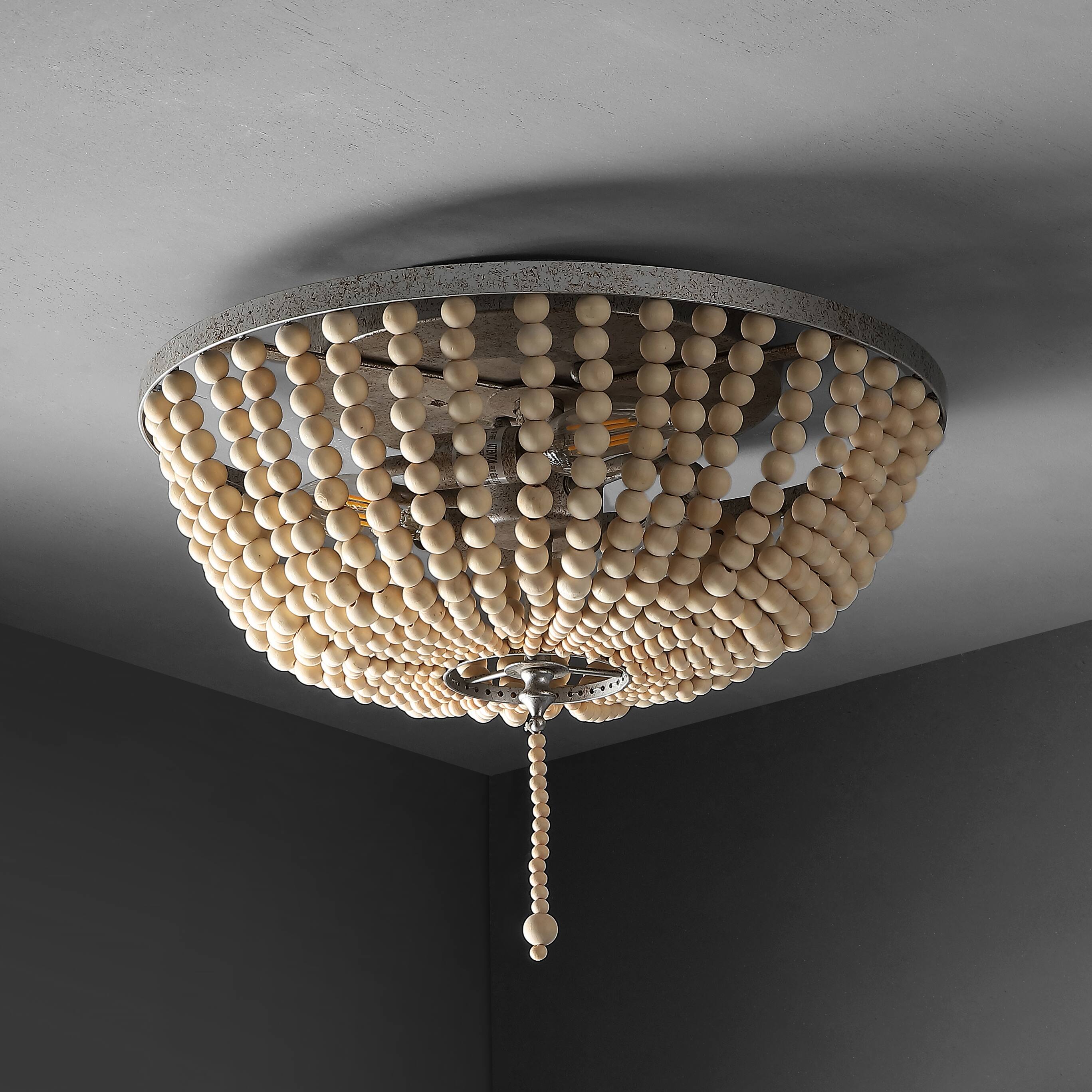 The image does not contain any text to group or correct. It shows a modern chandelier with numerous spherical elements hanging from a circular fixture.