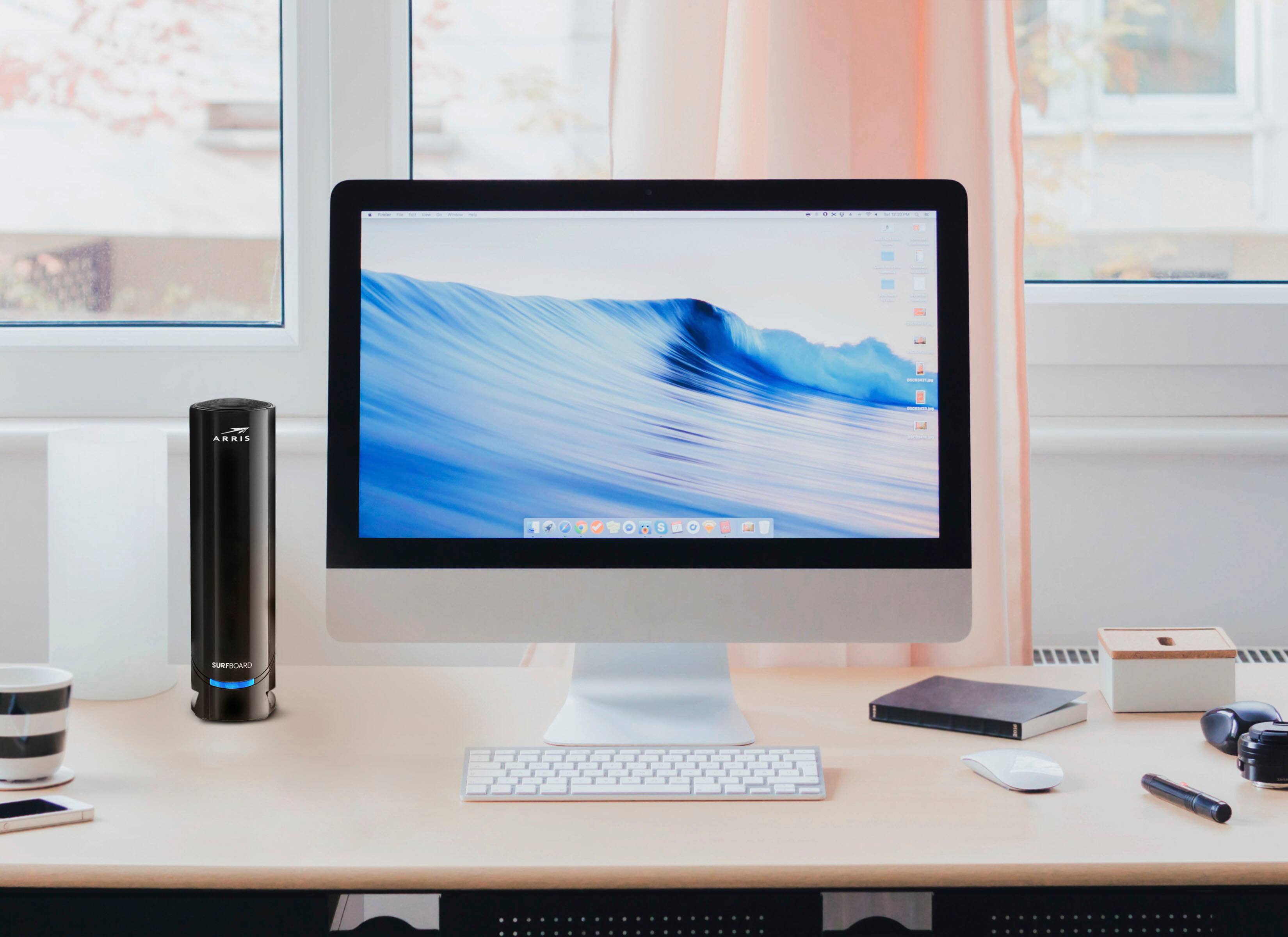 A Surfboard card is on the desk.