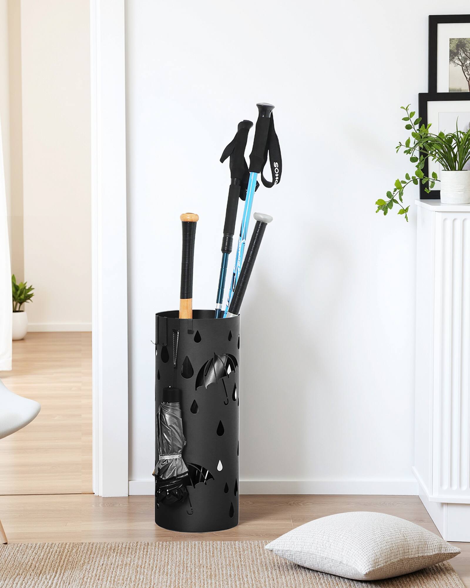 Left. Songmics Home - Umbrella Stand, Metal Umbrella Holder for Entryway, with Water Tray and 4 Hooks, 7.7 x 7.7 x 19.3 Inches, Round - Ink Black.