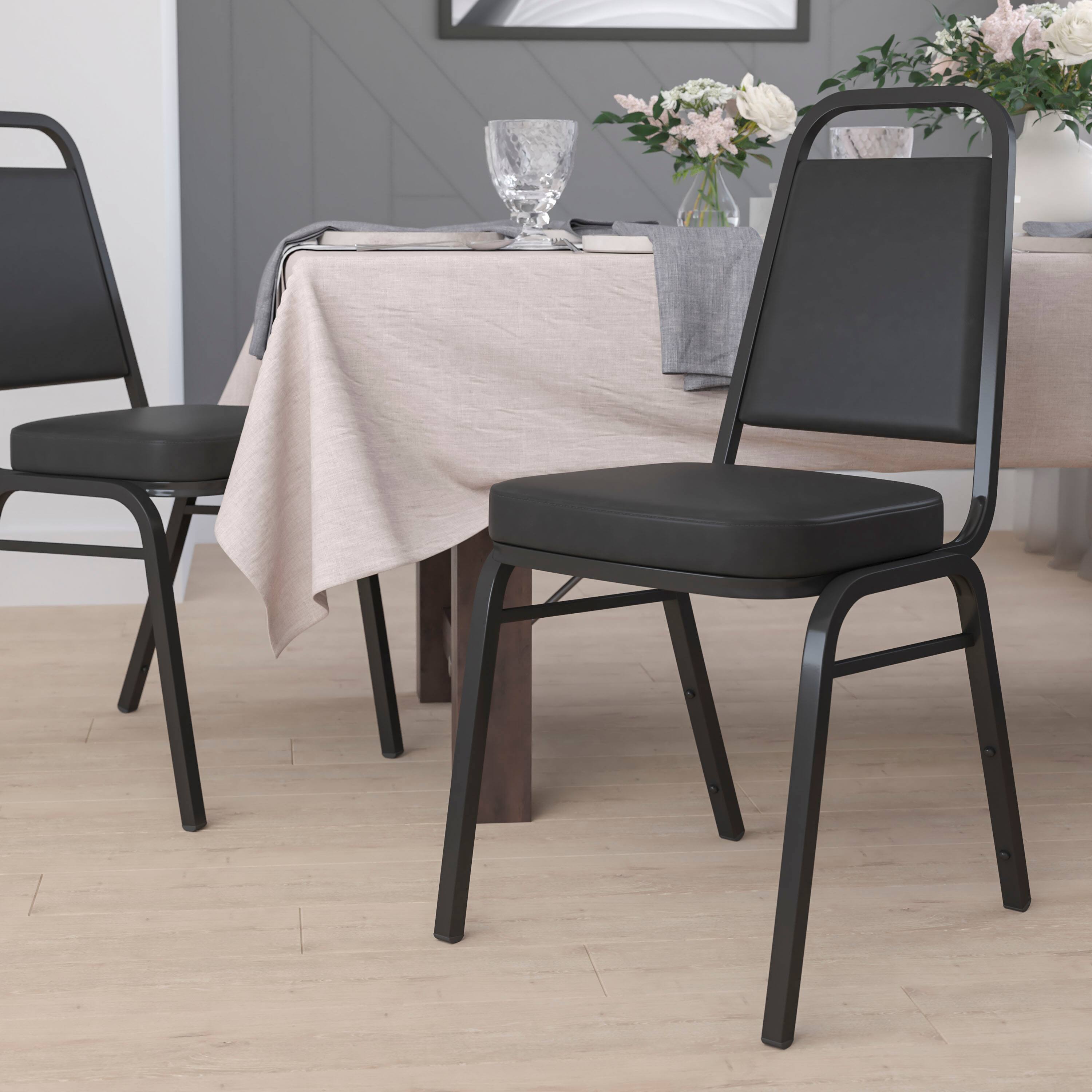 Alt View 2. Emma + Oliver - 4 Pack Trapezoidal Back Stacking Banquet Chair - Black Vinyl/Black Frame.