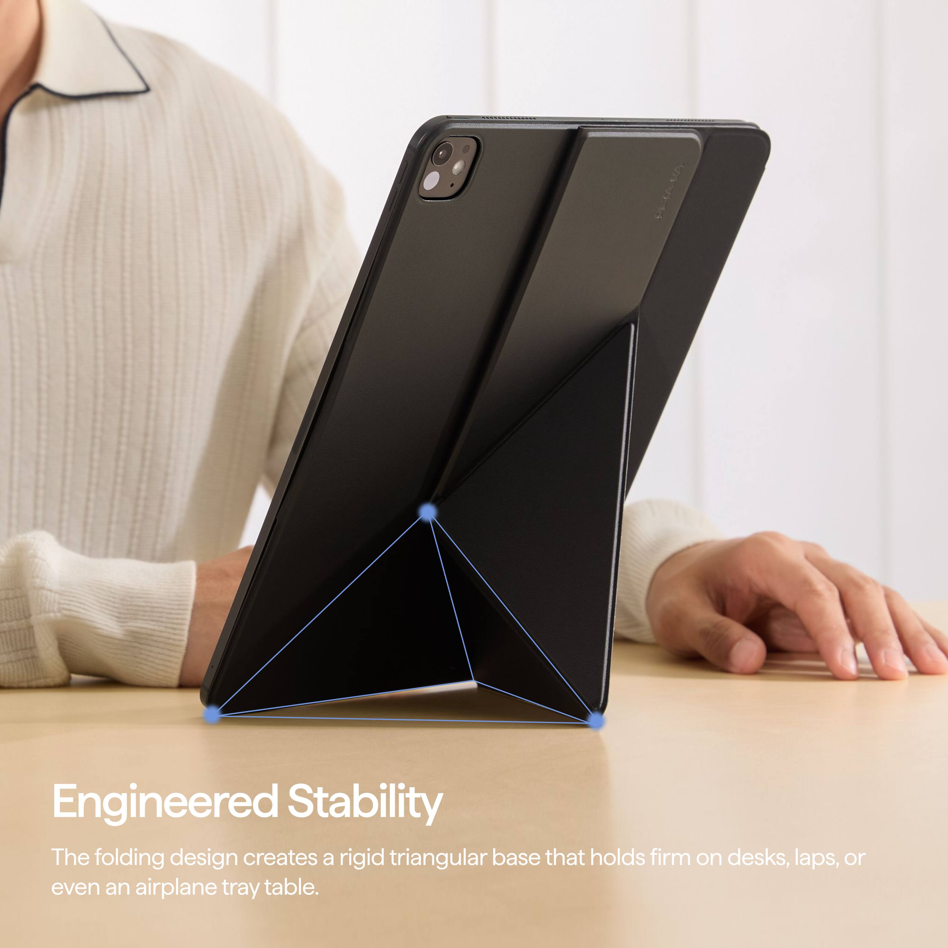 Engineered Stability  
The folding design creates a rigid triangular base that holds firm on desks, laps, or even an airplane tray table.