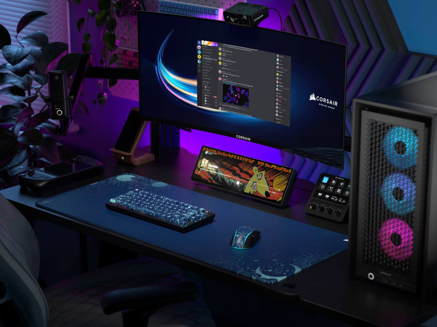 The image features a computer desk with a monitor, keyboard, mouse, and speakers. The monitor is turned on, and there are two keyboards and a mouse on the desk. The desk also has a potted plant and a chair nearby. The computer setup appears to be a gaming or workstation setup, with the monitor and speakers likely providing an immersive gaming experience or enhanced audio quality for work-related tasks.