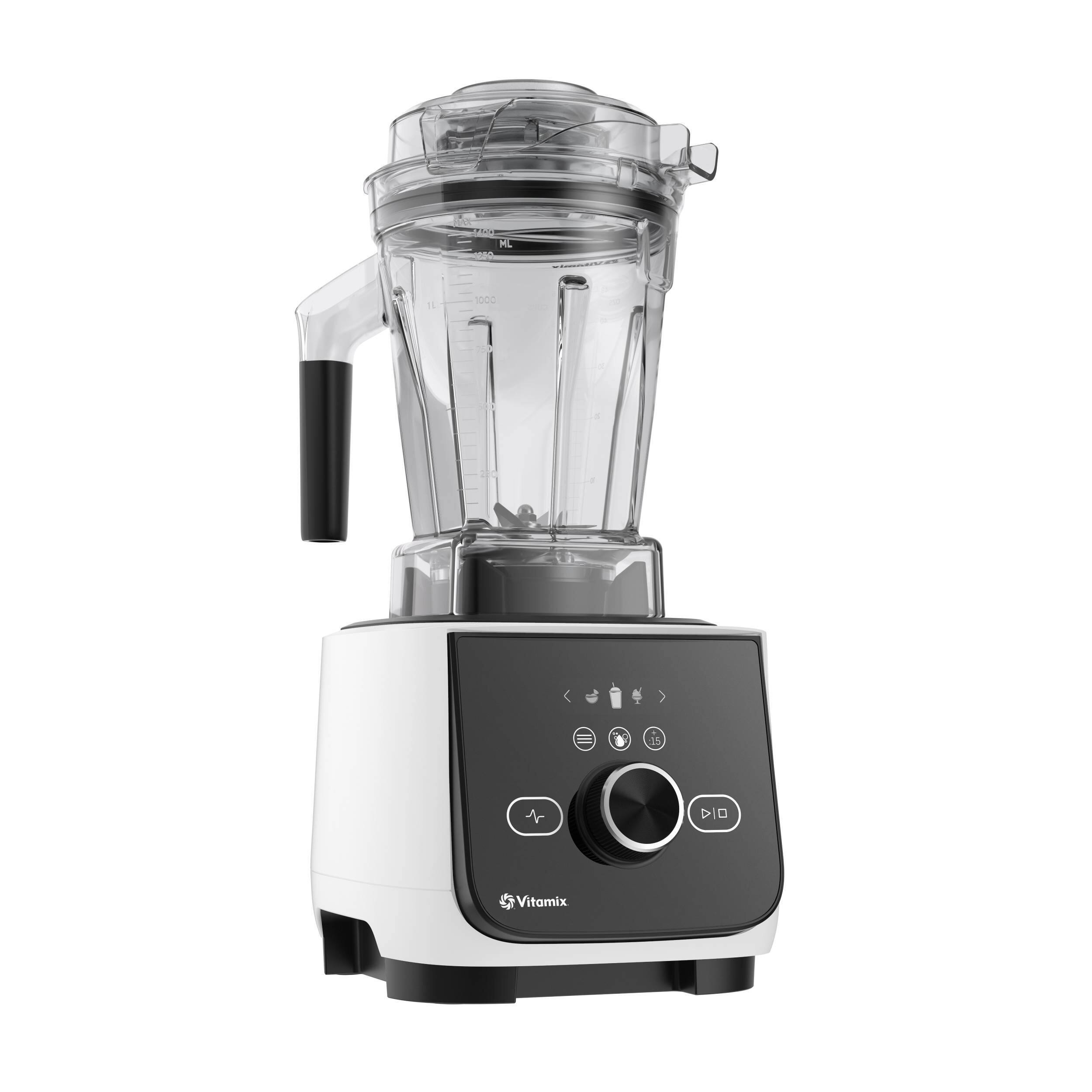 The image shows a white and black Vitamix blender, which is a powerful kitchen appliance. The blender is designed to blend and mix various ingredients, making it ideal for preparing smoothies, soups, and other recipes. The blender is equipped with a motor and a container, which is filled with ingredients. The motor is located at the top of the blender, and the container is situated at the bottom. The blender is ready to be used, and it is an essential tool for those who enjoy cooking and preparing healthy meals.