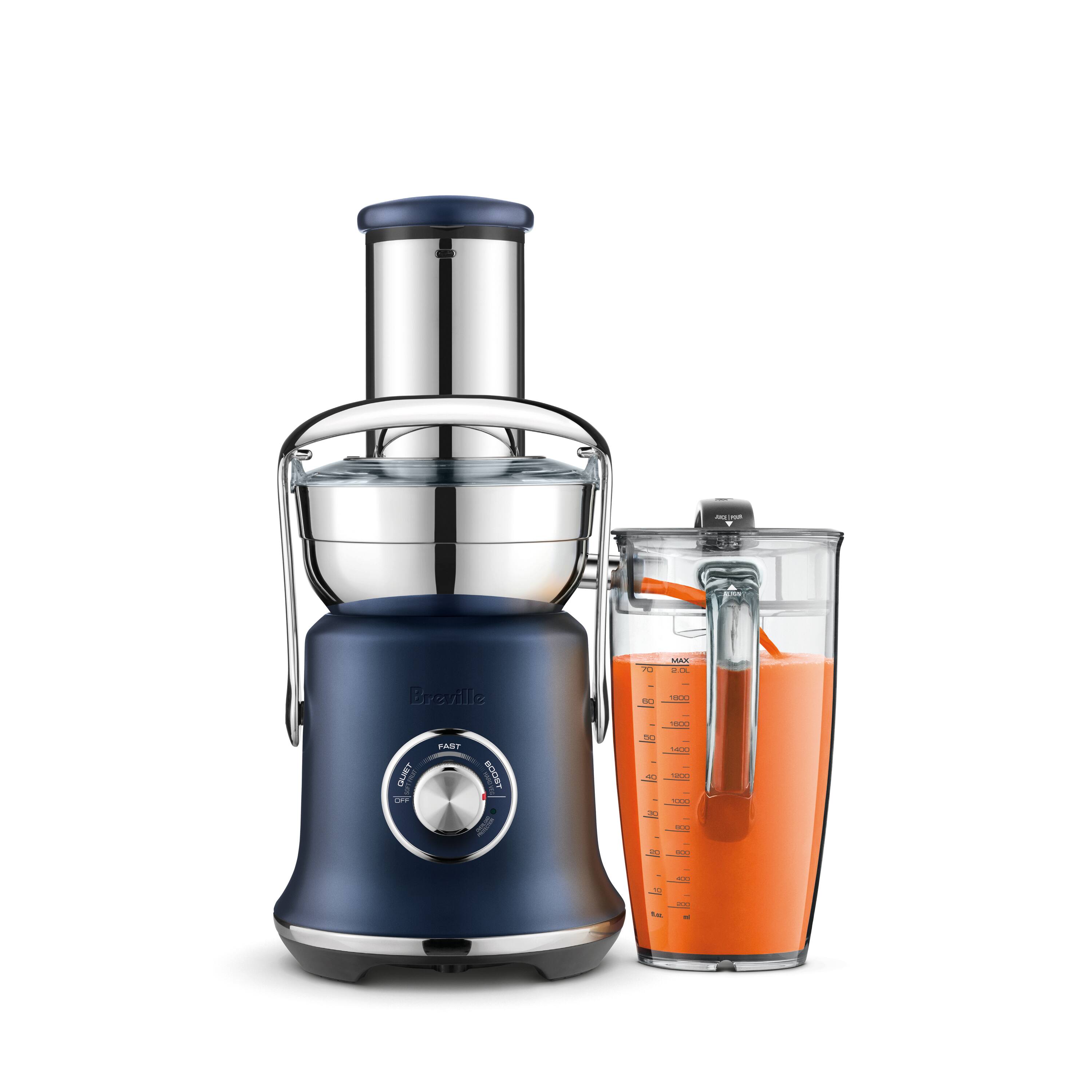Breville TM65XL Quiet Boost Blender with a measuring cup.
