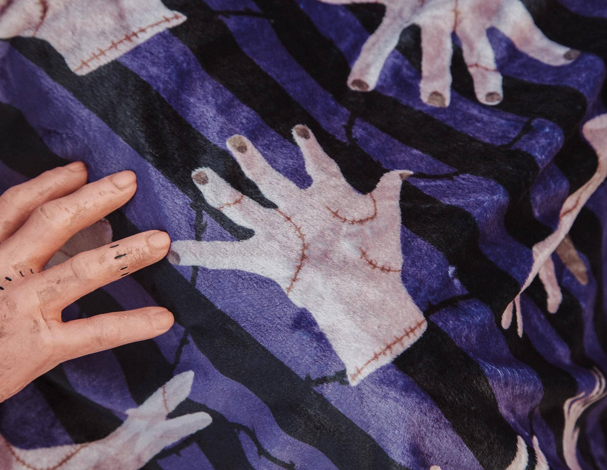 Alt View 5. Silver Buffalo - Addams Family Wednesday Thing Raschel Throw Blanket | 45 x 60 Inches - Purple.