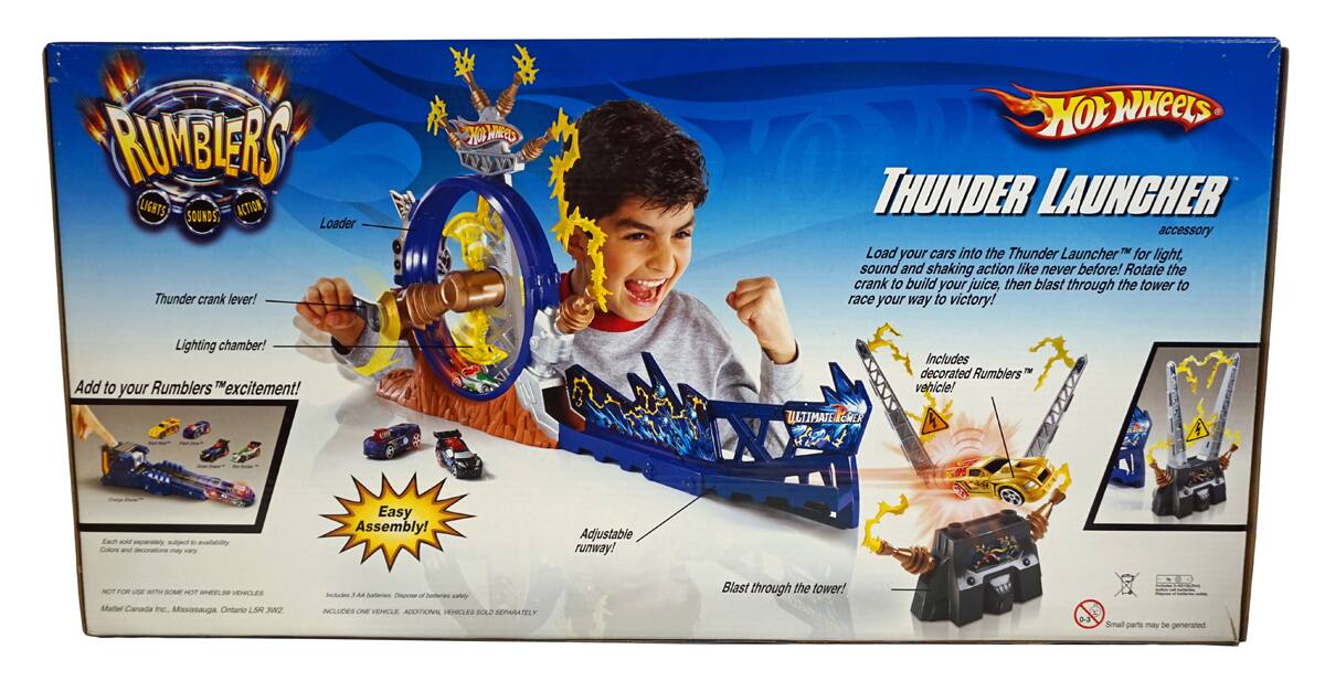 **RUMBLERS LIGHTS SOUNDS ACTION**

**THUNDER LAUNCHER accessory**

Load your cars into the Thunder Launcher™ for light, sound and shaking action like never before! Rotate the crank to build your juice, then blast through the tower to race your way to victory!

**Thunder crank lever!**
**Lighting chamber!**
Add to your Rumbler's "excitement!"

**ULTIMATECHE**

Includes decorated Rumbler's vehicle!

Easy Assembly!
Adjustable runway!

Blast through the tower!

**NOT FOR USE with HOT WHEELS® VEHICLES**

**Hot Wheels**

**Fach - - aalpn d avalabality Collore and decoratons may vary**

**Easy Assembly!**

**Adjustable runway!**

**NOT FOR USE with HOT WHEELS® VEHICLES**

**Mattel Canada Inc. Mississauga Ontario L5T 3W2**

**INCLUDES ONE VEHICLE ADDITIONAL VEHICLES SOLD SEPARATELY**

**Small parts may be generated**

**WARNING: CHOKING HAZARD - Small parts. Not for children under 3 years.**