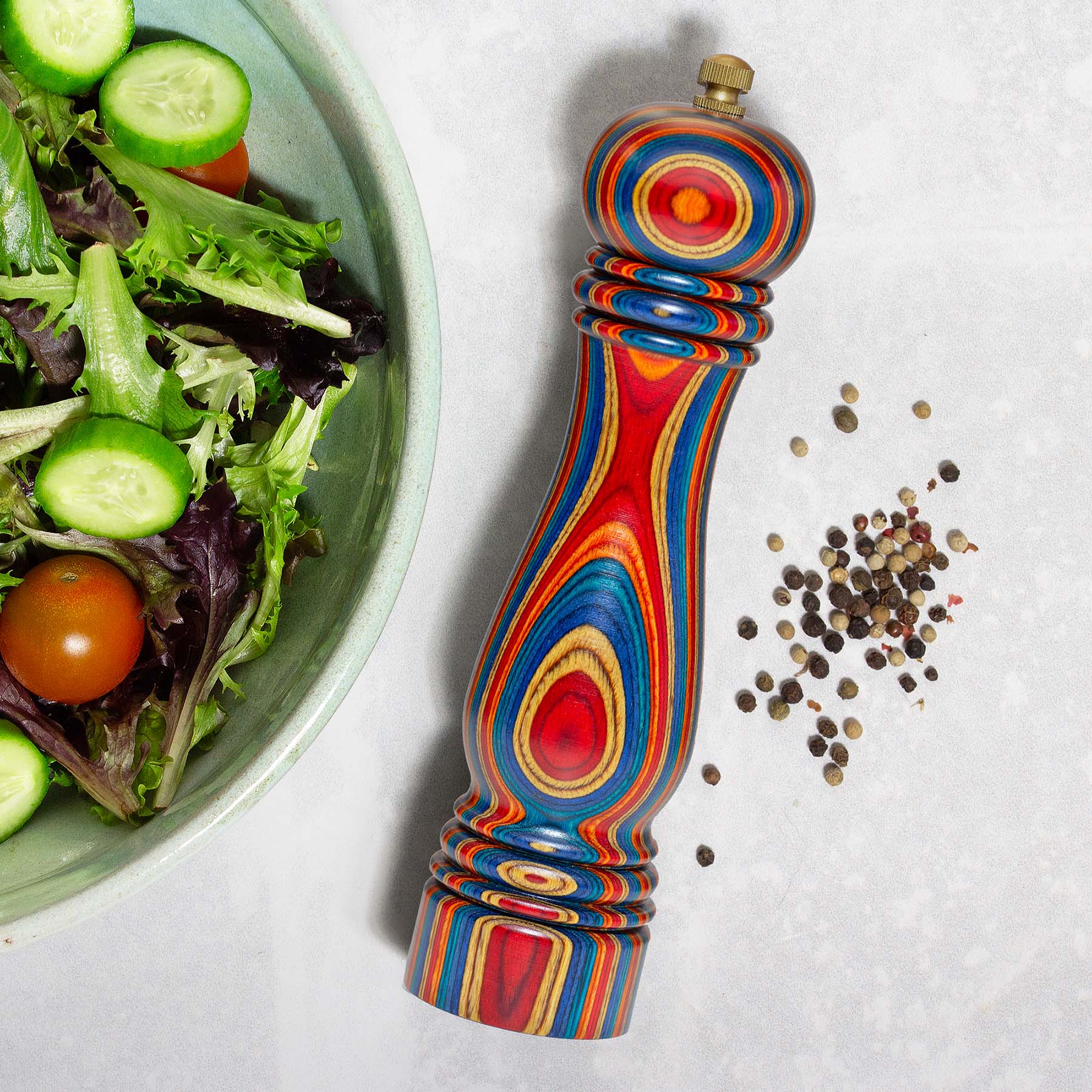 Angle. Baltique - Montego Bay Collection Refillable Pepper Grinder - Blue, Orange, Red, Yellow.