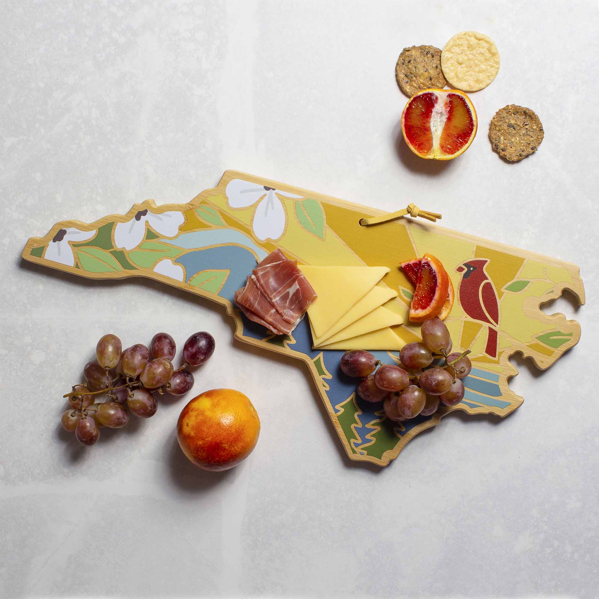 Angle. Totally Bamboo - North Carolina Cutting Board with Artwork by Summer Stokes.
