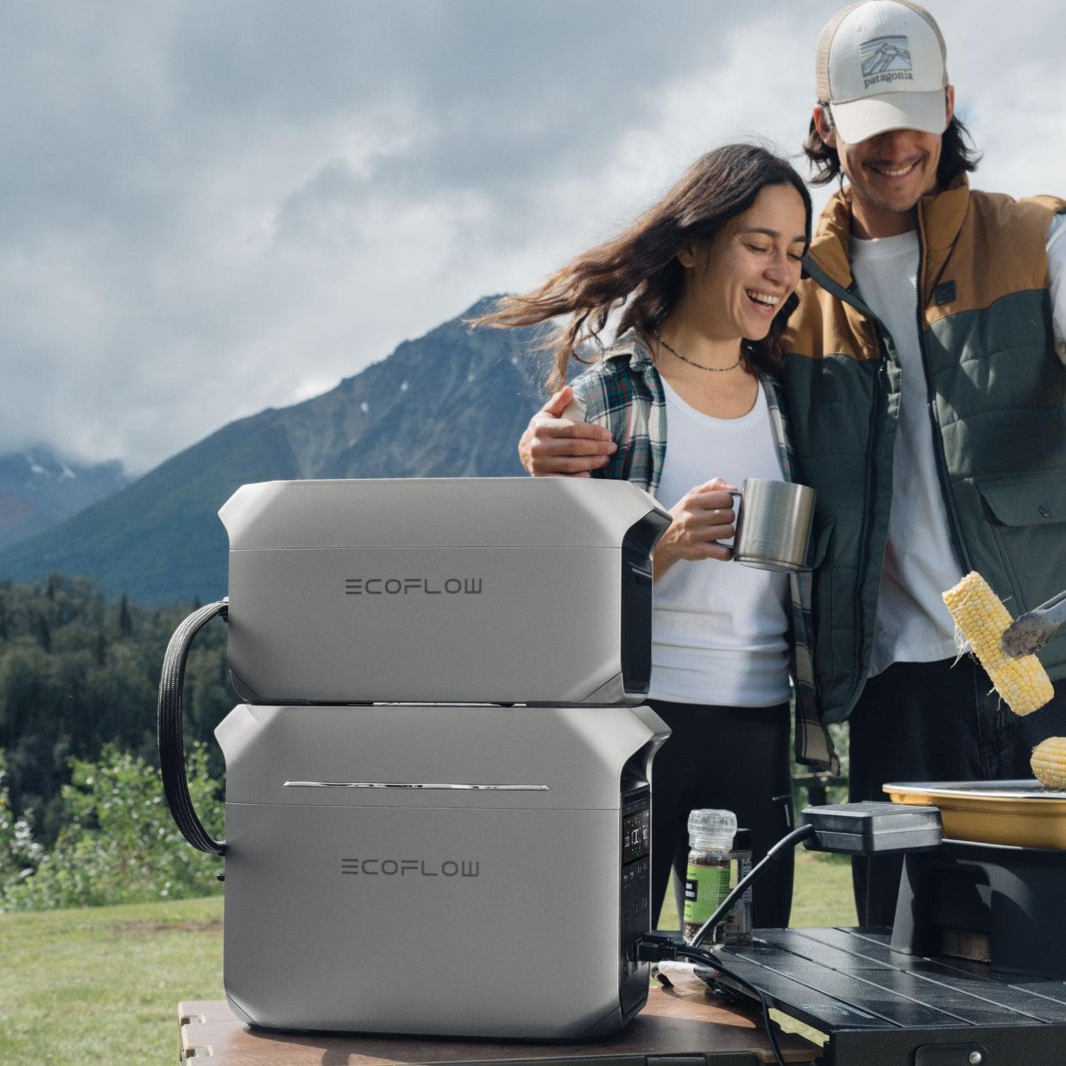 Patagonia COFLOW is a brand that offers outdoor gear and equipment, such as portable stoves and cooking systems. In the image, a man and a woman are standing next to a portable stove, which is likely a product from the COFLOW brand. They seem to be enjoying their time outdoors, possibly on a camping trip or a picnic. The presence of a portable stove suggests that they are using it to cook food, making their outdoor experience more convenient and enjoyable.