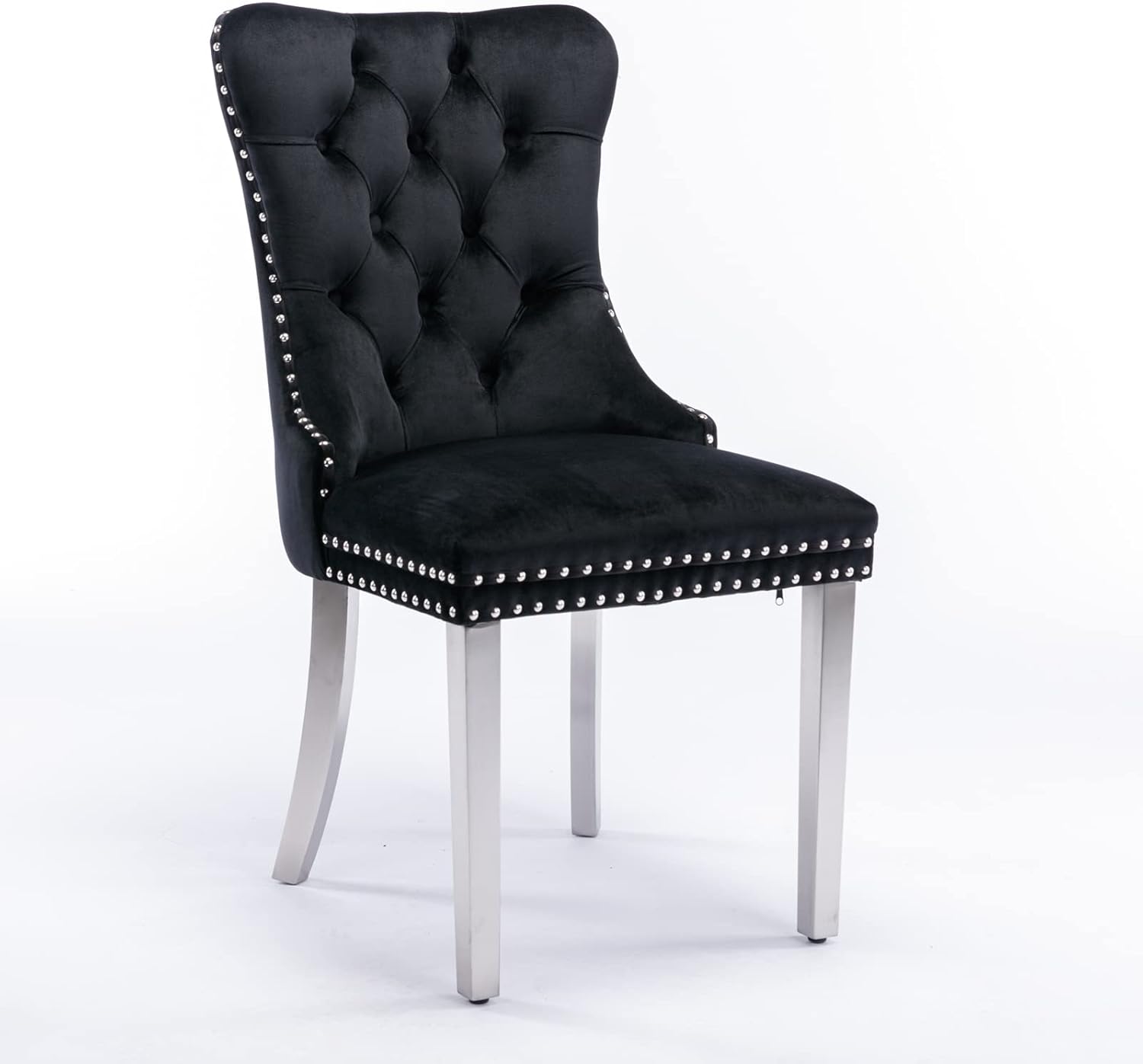 The image shows a black tufted chair with silver nailhead trim and chrome legs.