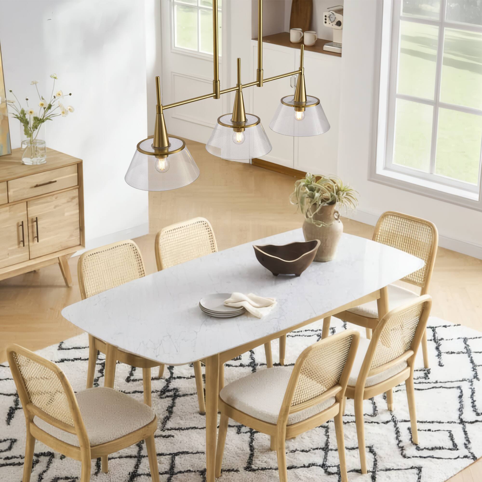 Left. RYHNUYNE - 3-Light Brass Kitchen Island Pendant 34 Inch Modern Linear Chandelier with Clear Seed Glass Shades.