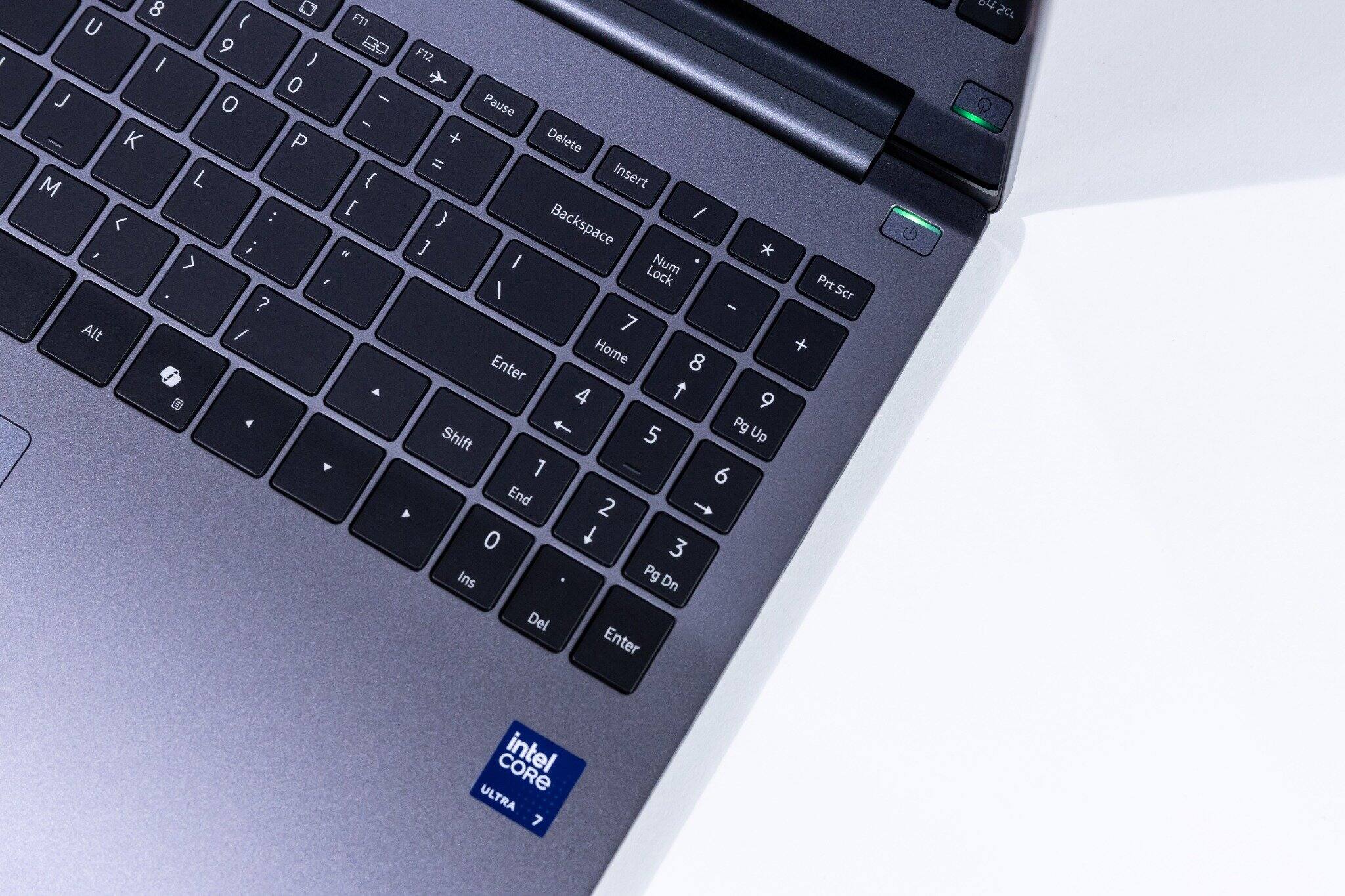 Sure, here is the corrected and grouped text from the image:

**Top Row:**
- F11
- F12
- Pause
- Delete
- Insert

**Number Row:**
- 7
- 8
- 9
- +
- 4
- 5
- 6
- -
- 1
- 2
- 3
- Enter
- 0
- .
- /
- Enter

**Left Side:**
- U
- I
- O
- P
- K
- L
- M
- <
- ,
- >
- .
- /
- Alt
- Spacebar
- Shift
- Ctrl

**Right Side:**
- Backspace
- Num Lock
- /
- *
- -
- +
- Home
- Pg Up
- End
- Pg Dn
- Ins
- Del

**Sticker:**
- intel CORE ULTRA 7

**Other:**
- 8412CL