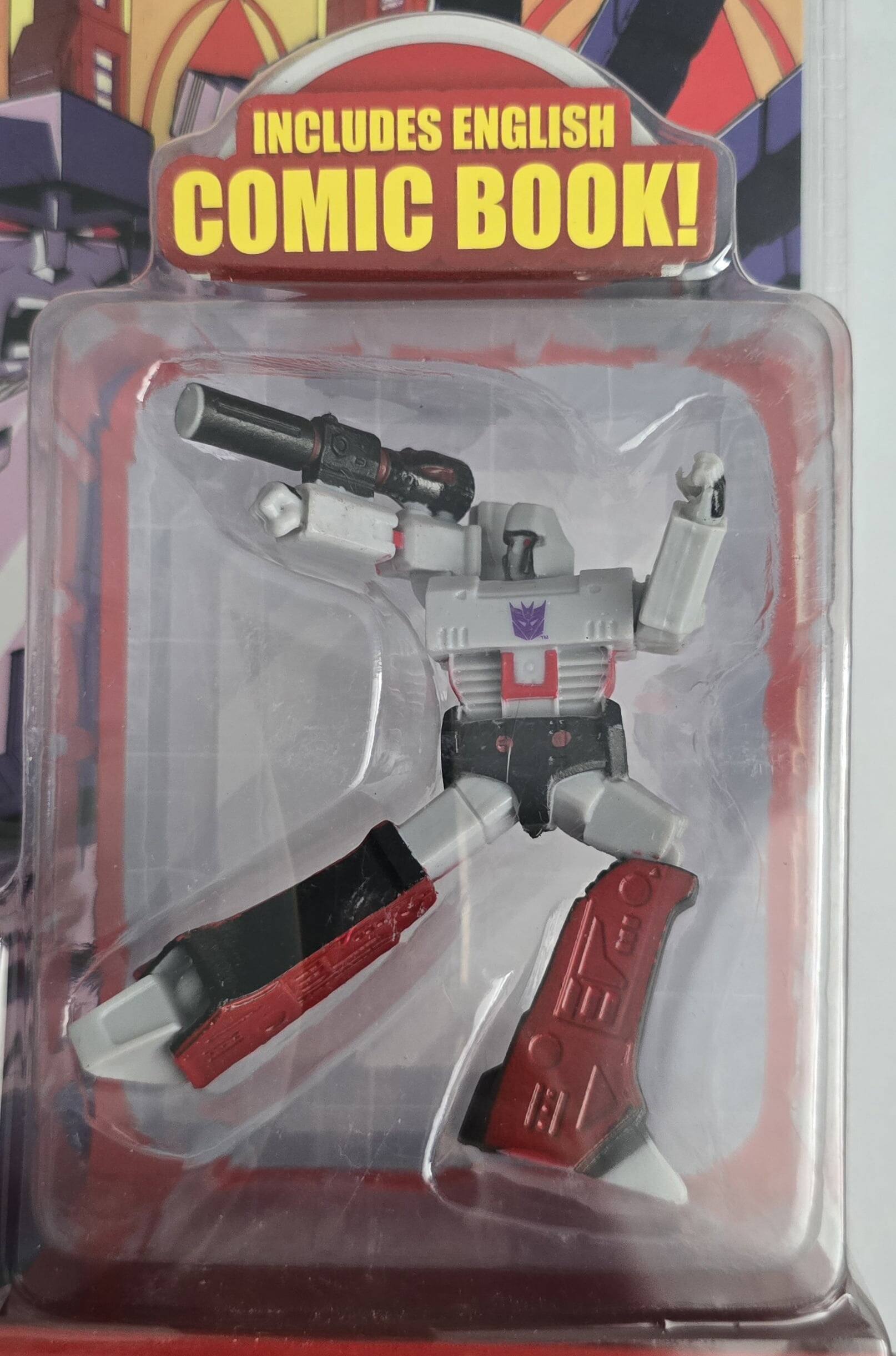 The text on the image reads: "INCLUDES ENGLISH COMIC BOOK!"