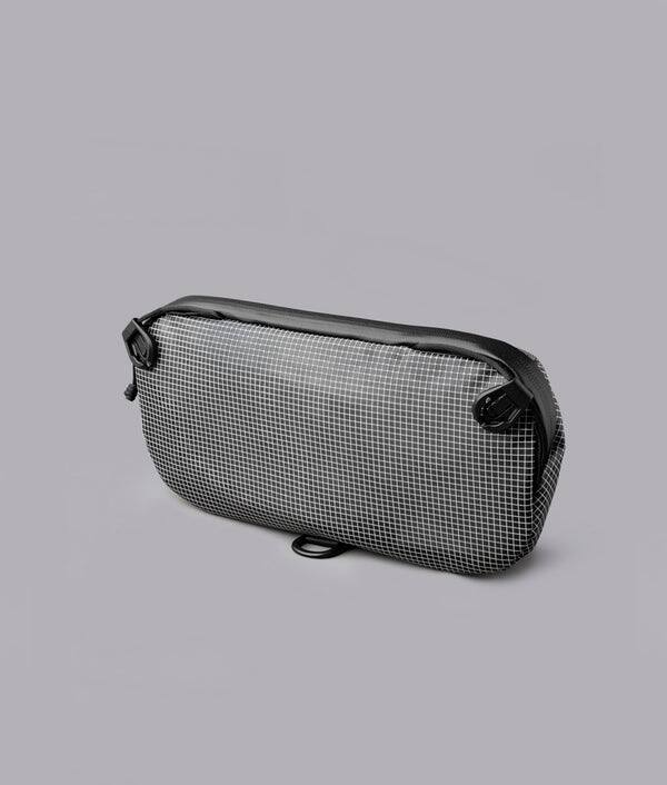 Back. ALPAKA - Lightweight Crossbody Sling Bag for Travel, Phone, Wallet & Passport, Momentum Sling, Weather-Resistant - Axodyne hybrid Grey.