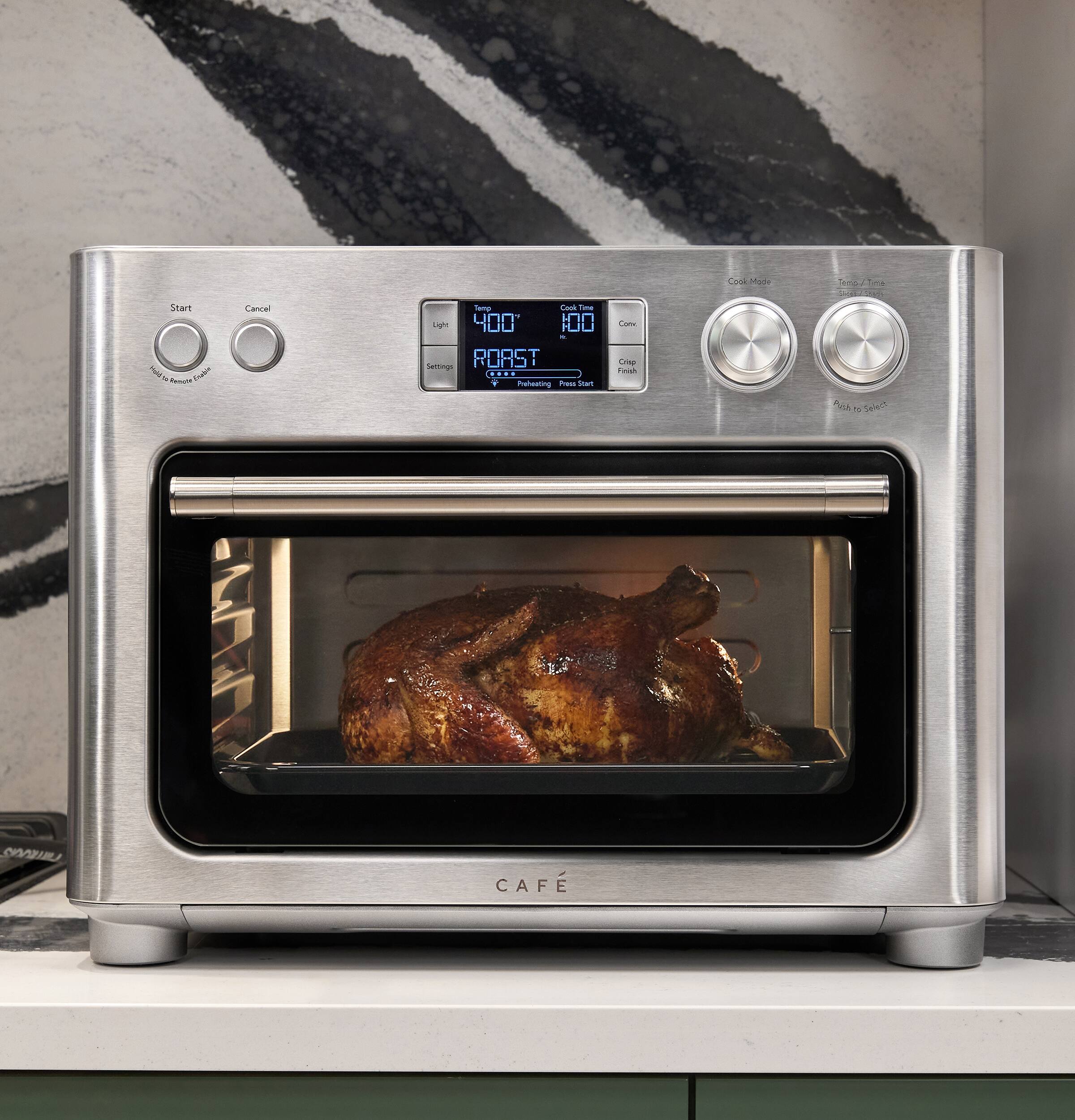 Start Hold the Pendant Cable

Cancel

Temp Cook Time Light 100 100 B Settings ROAST .... Preheating Press Start

Cook Crisp Finish

Cook Mode

Temp Fire STROBLE Push to Select

SYDIAJILY

CAFE