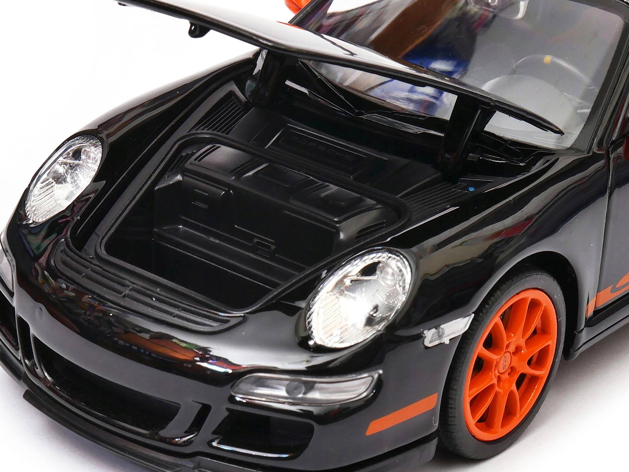 Angle. Welly - Porsche 911 (997) GT3 RS Black with Orange Accents 1/24-1/27 Diecast Model Car by Welly - Black with Orange.