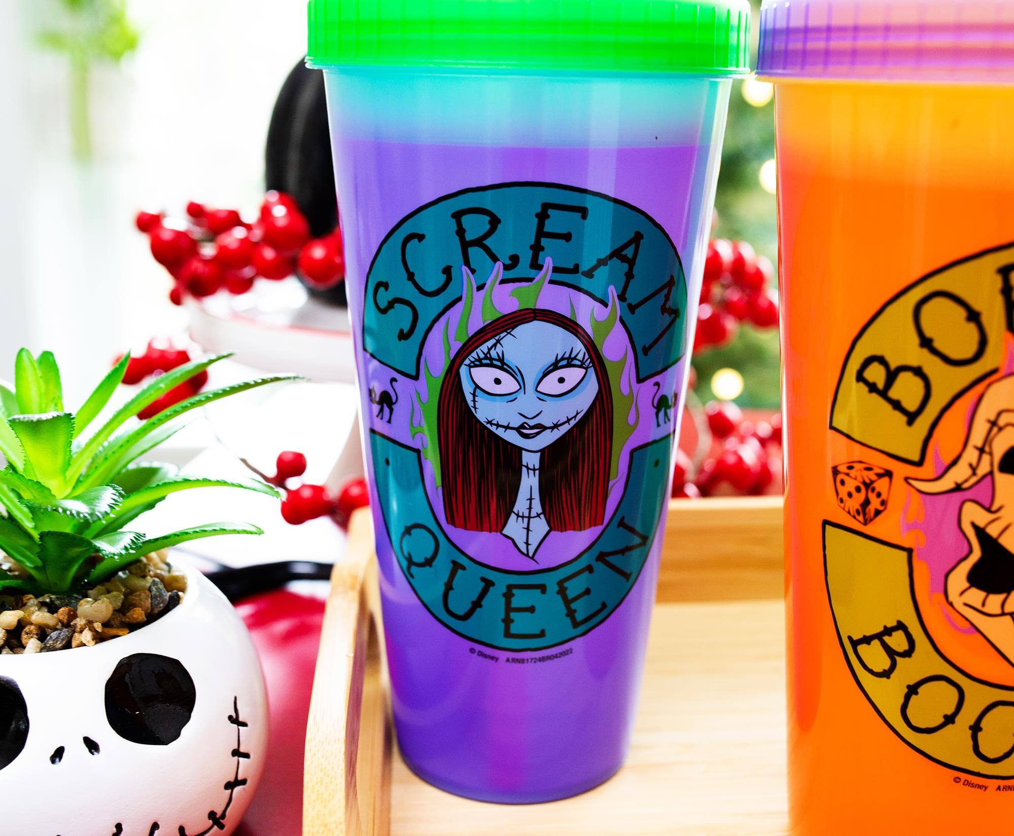 Sure! Here is the corrected and grouped text from the image:

**Left Cup:**
- SCREAM QUEEN

**Right Cup:**
- BOO BOO