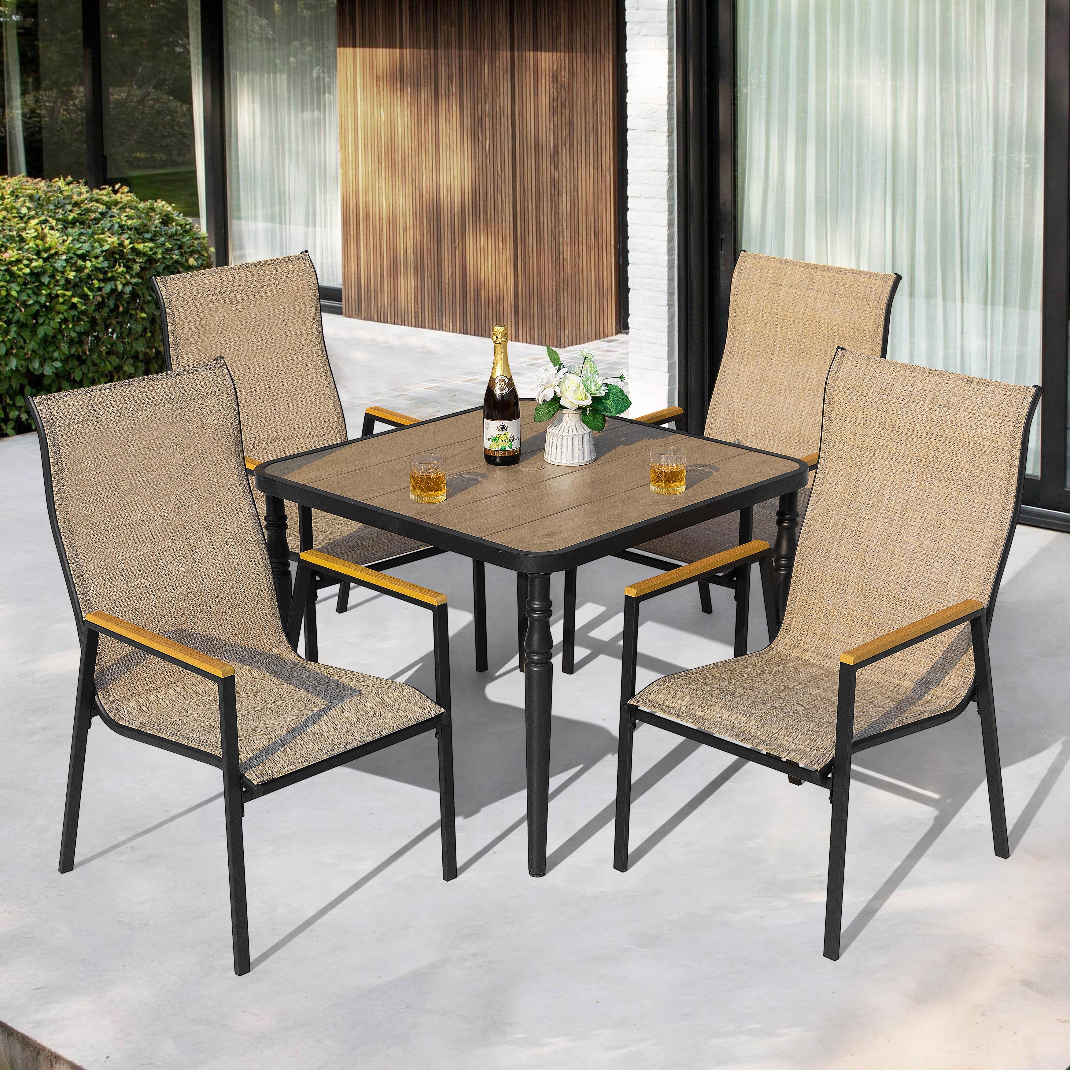 Angle. Nuu Garden - 5-Piece Textilene Patio Dining Set with Umbrella Hole, Stackable Design, Faux Wood Armrests - Black and Khaki.