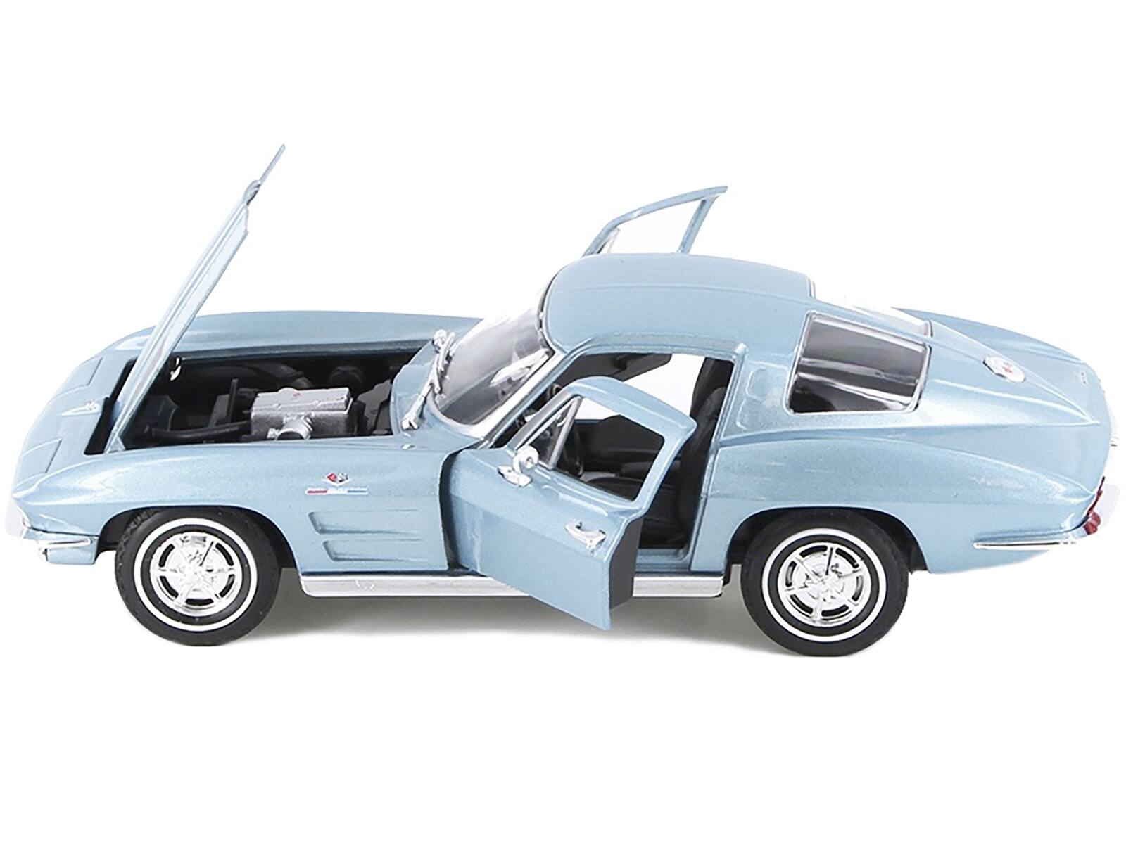 Left. Welly - 1963 Chevrolet Corvette Light Blue Metallic 1/24-1/27 Diecast Model Car by Welly - Light Blue Metallic.